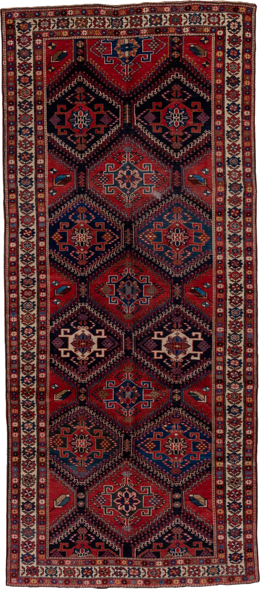 4' x 9' one-of-a-kind handmade vintage Baktiary runner rug. Color palette: black, blue, brown, fiord, gray, pink, red