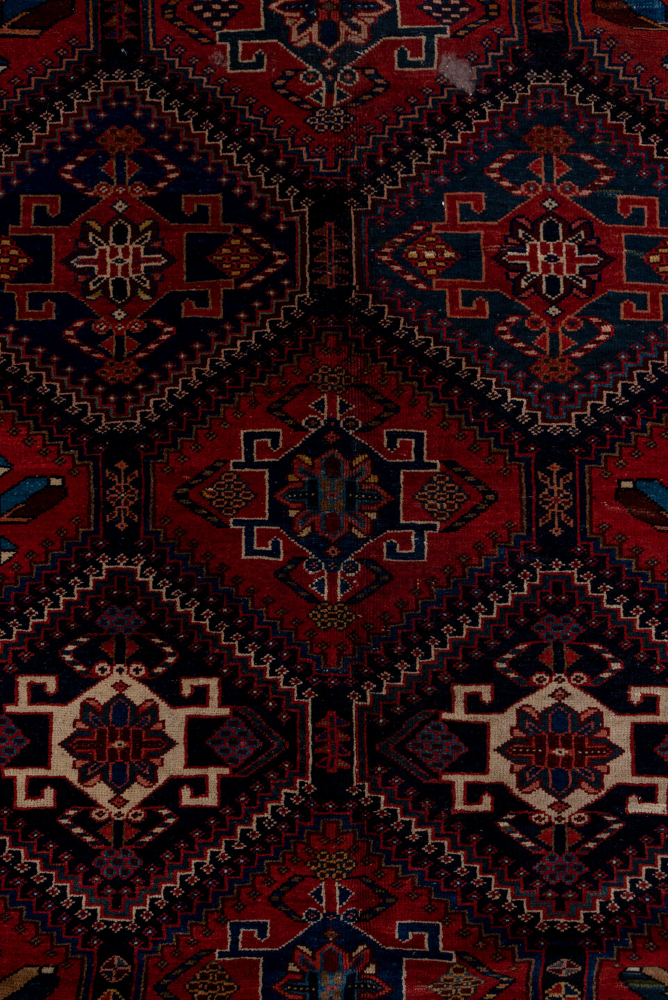4' x 9' one-of-a-kind handmade vintage Baktiary runner rug. Color palette: black, blue, brown, fiord, gray, pink, red