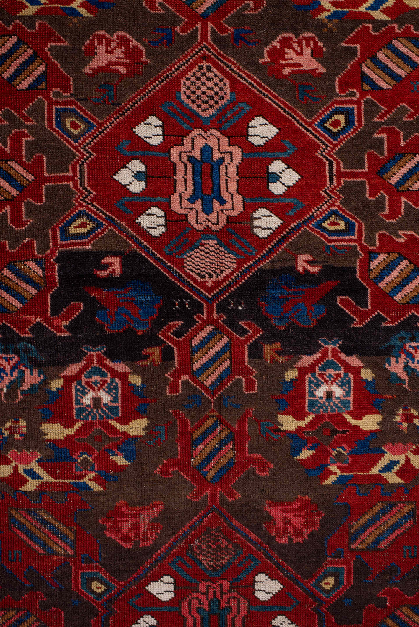 3' x 6' one-of-a-kind handmade vintage Zeichur small size rug. Color palette: brown, red, blue, crimson, ivory, pink