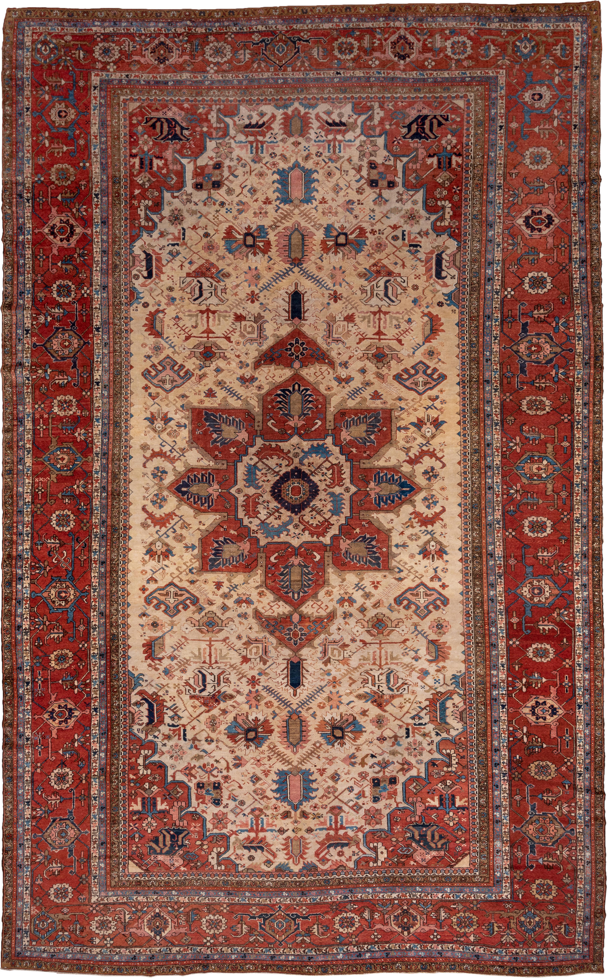 12' x 18' one-of-a-kind handmade antique Serapi oversize rug. Color palette: ivory, rust, brick red, indigo, sky blue, camel