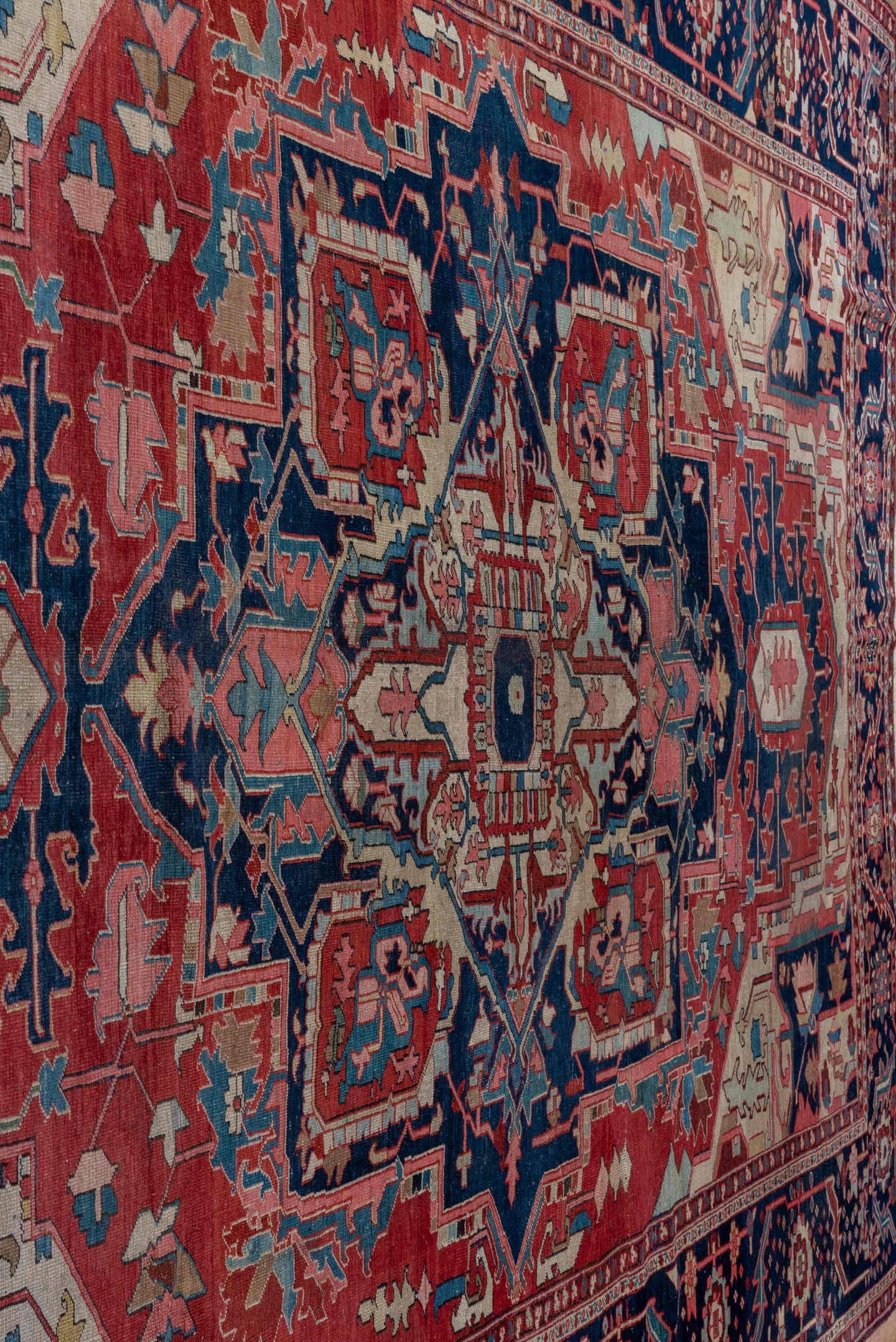 9' x 13' one-of-a-kind handmade antique Serapi large size rug. Color palette: rust, navy, ivory, sky_blue, rose, slate