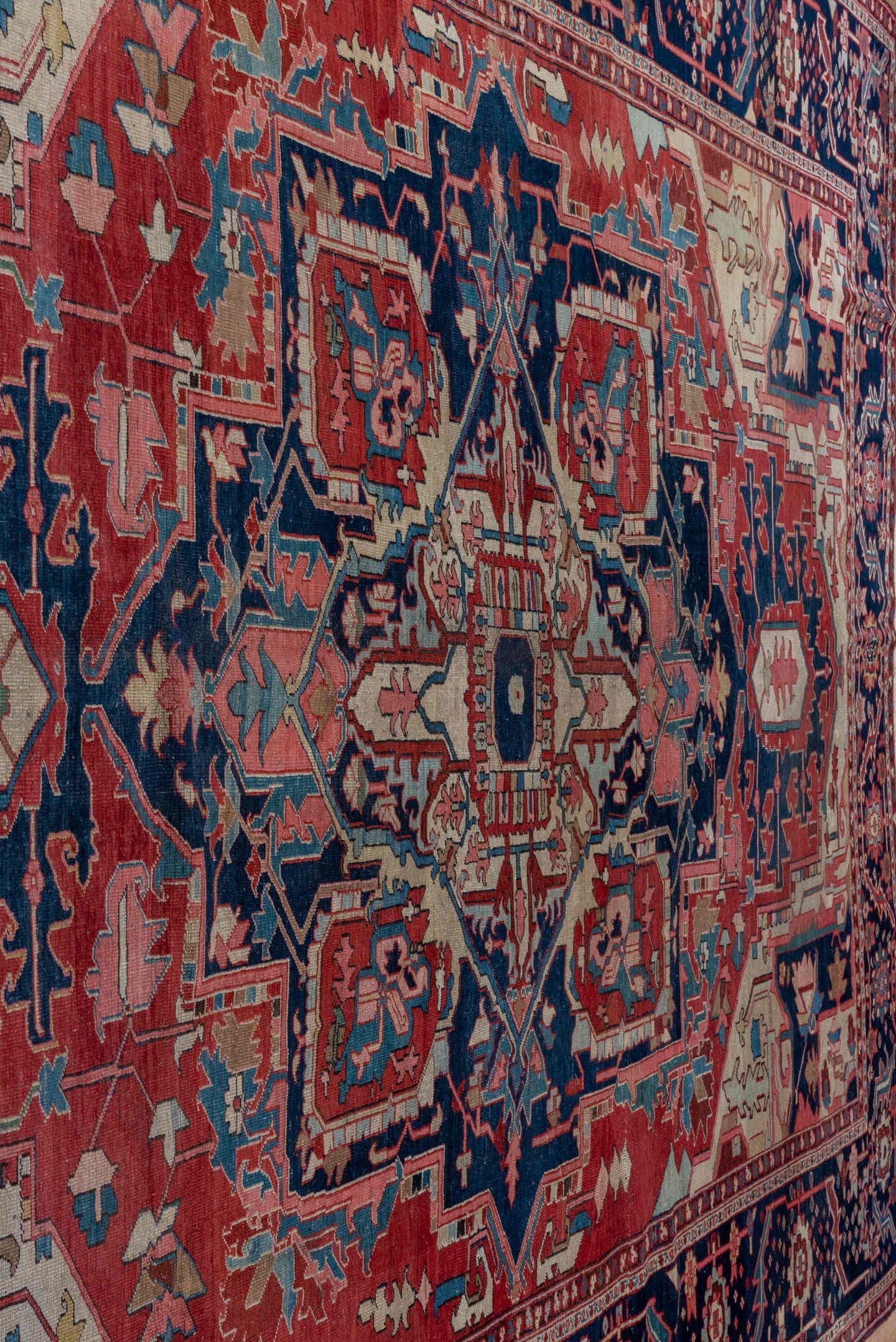 9' x 13' one-of-a-kind handmade antique Serapi large size rug. Color palette: rust, navy, ivory, sky_blue, rose, slate