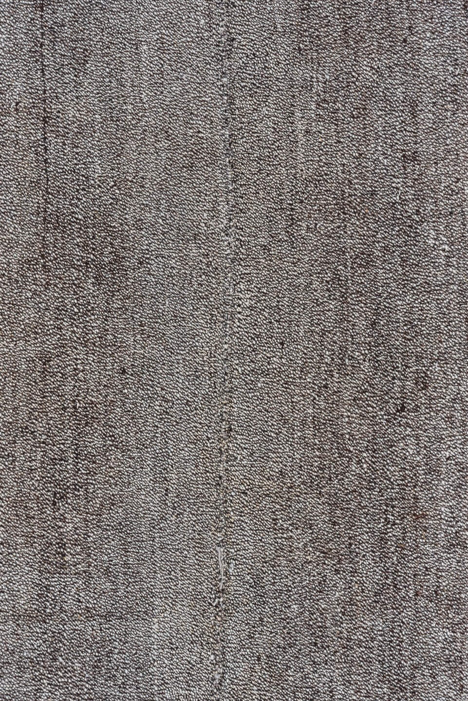 7' x 9' one-of-a-kind handmade antique Flatweave rug. Color palette: gray, charcoal, taupe, black, beige