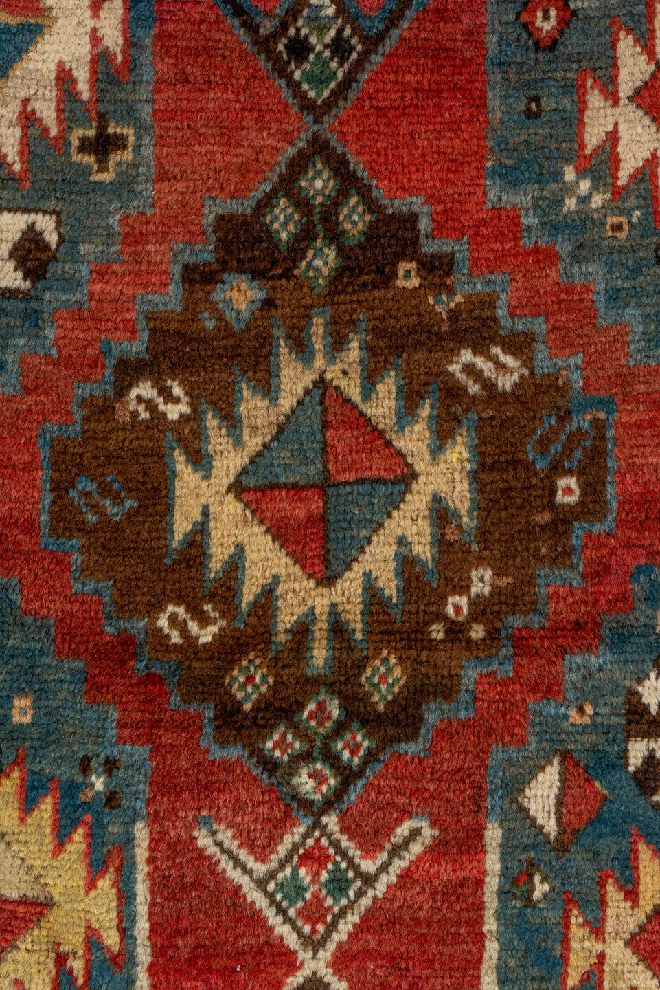 3' x 7' one-of-a-kind handmade antique Kazak rug. Color palette: rust, sky blue, ivory, navy, brown, black, camel, red