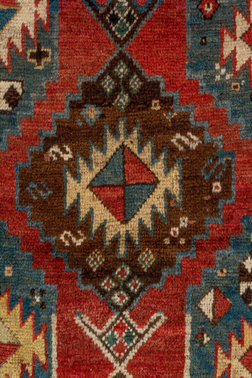 3' x 7' one-of-a-kind handmade antique Kazak rug. Color palette: rust, sky blue, ivory, navy, brown, black, camel, red