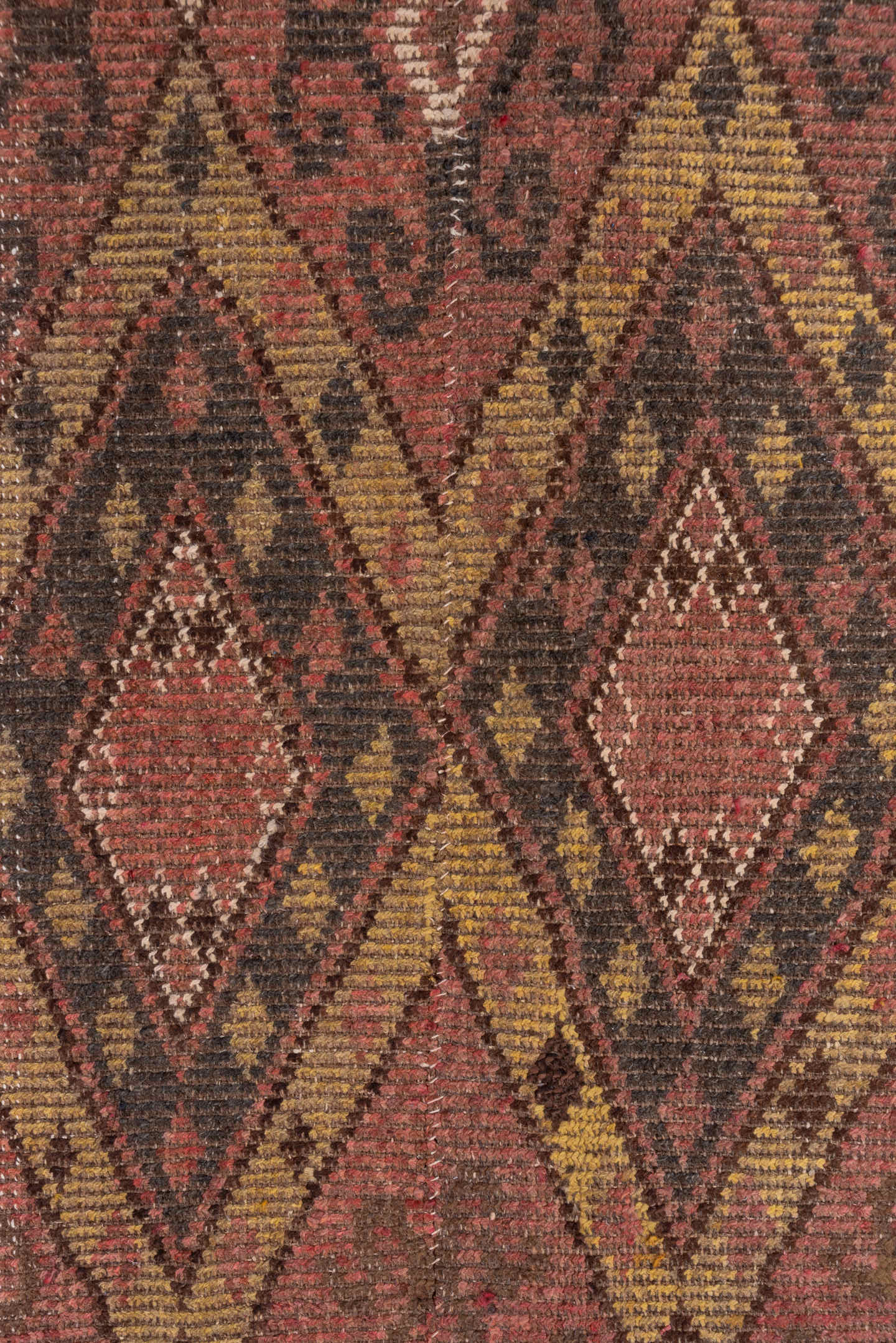 4' x 12' one-of-a-kind handmade antique Ouzbek runner rug. Color palette: rose, brown, ivory, ochre, mahogany, taupe, pink