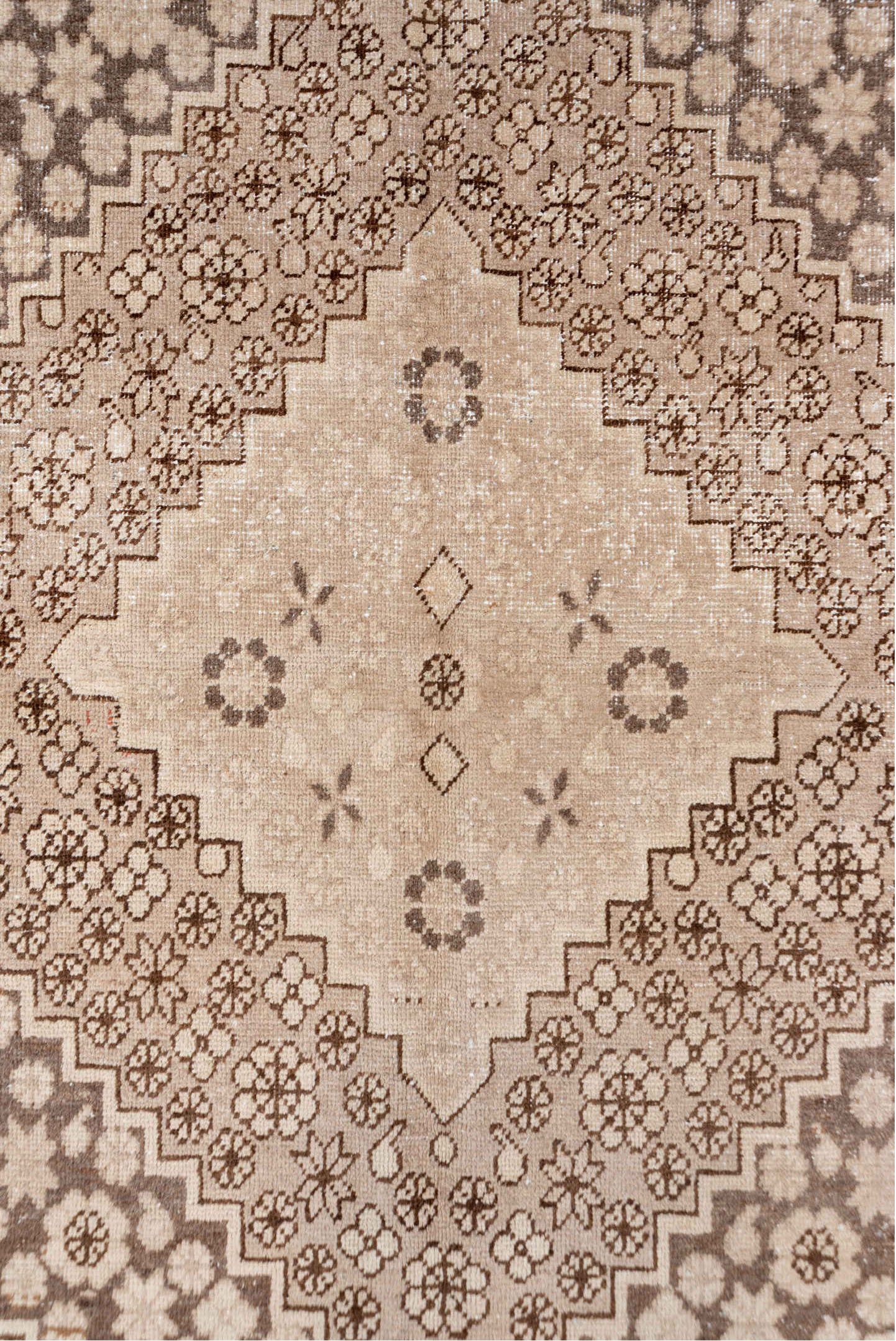5' x 8' one-of-a-kind handmade antique Khotan medium size rug. Color palette: beige, camel, taupe, ivory, brown, gray