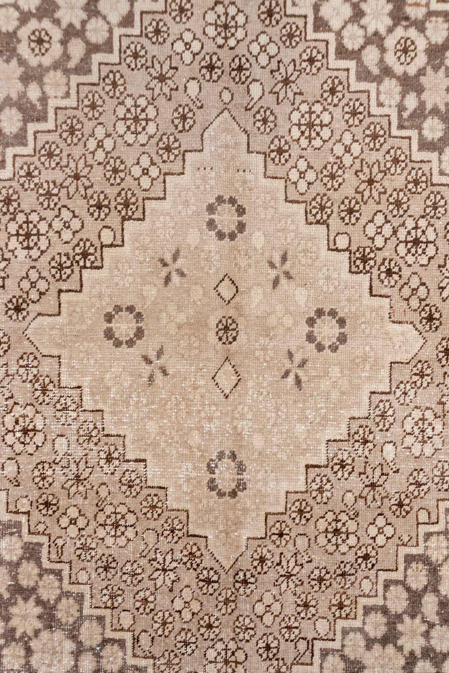 5' x 8' one-of-a-kind handmade antique Khotan medium size rug. Color palette: beige, camel, taupe, ivory, brown, gray