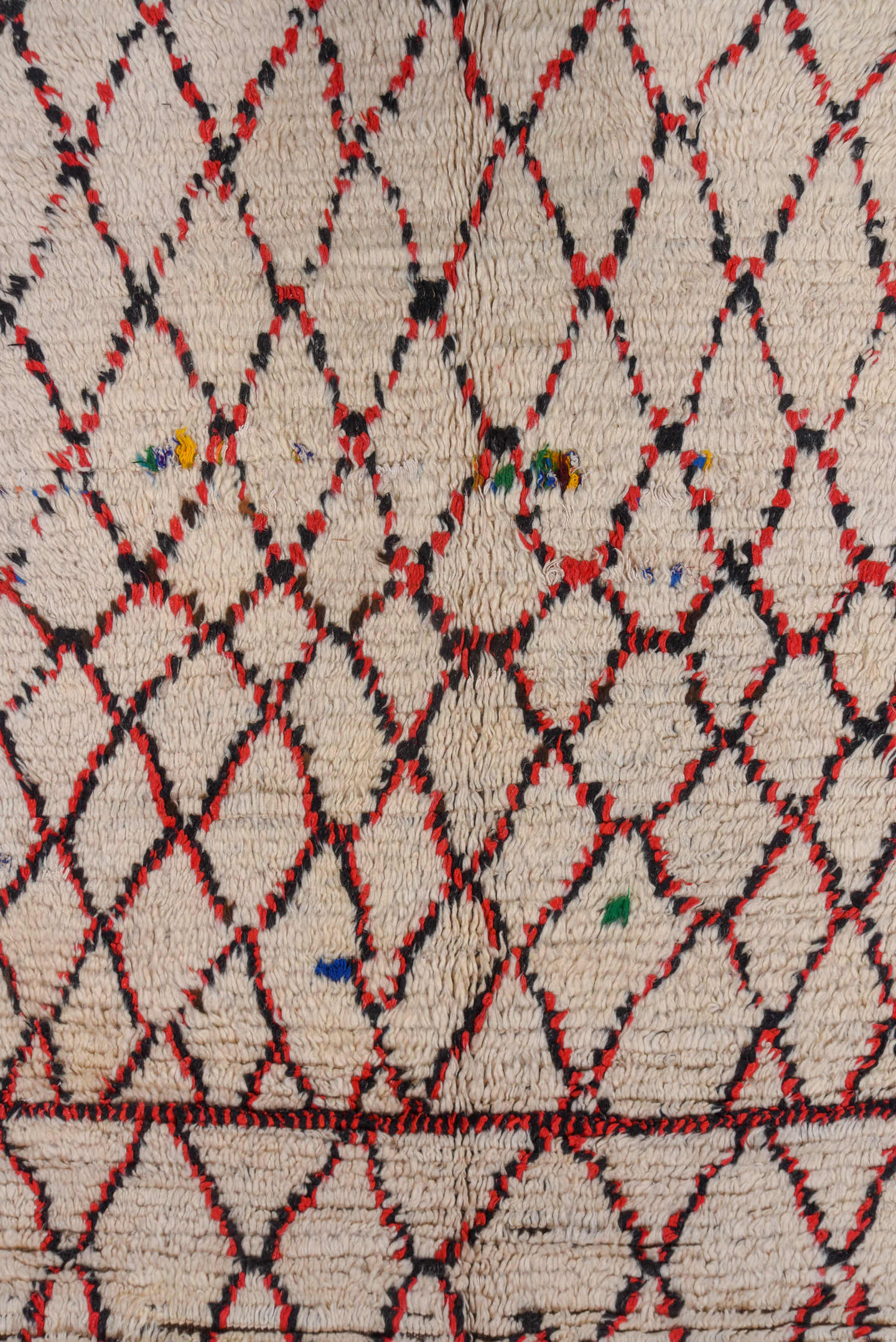 5' x 11' one-of-a-kind handmade vintage Moroccan rug. Color palette: ivory, black, red, coral, gold, blue, green, terracotta