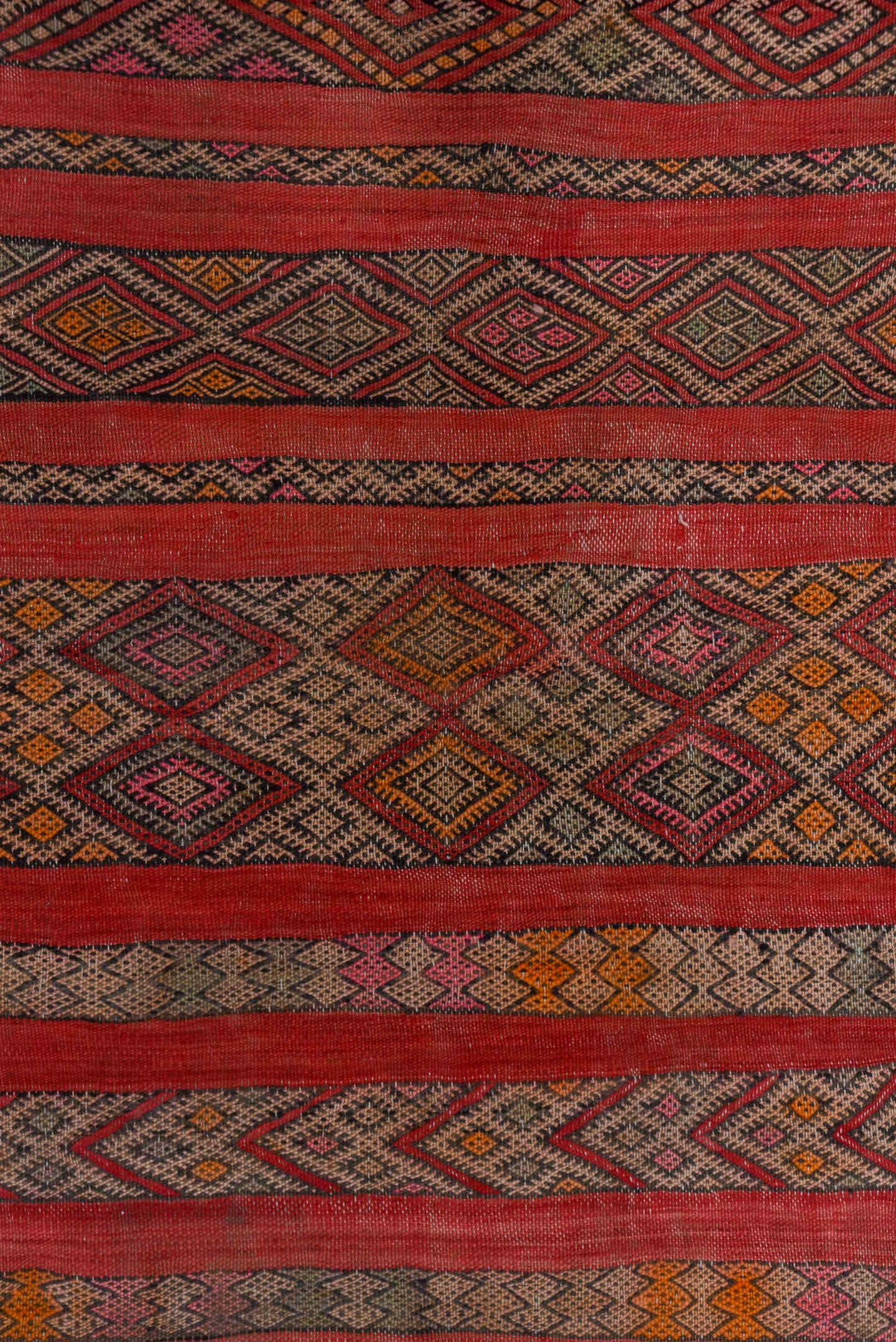 5' x 7' one-of-a-kind handmade vintage Kilim rug. Color palette: rose, rust, charcoal, taupe, ochre, pink, ivory, red