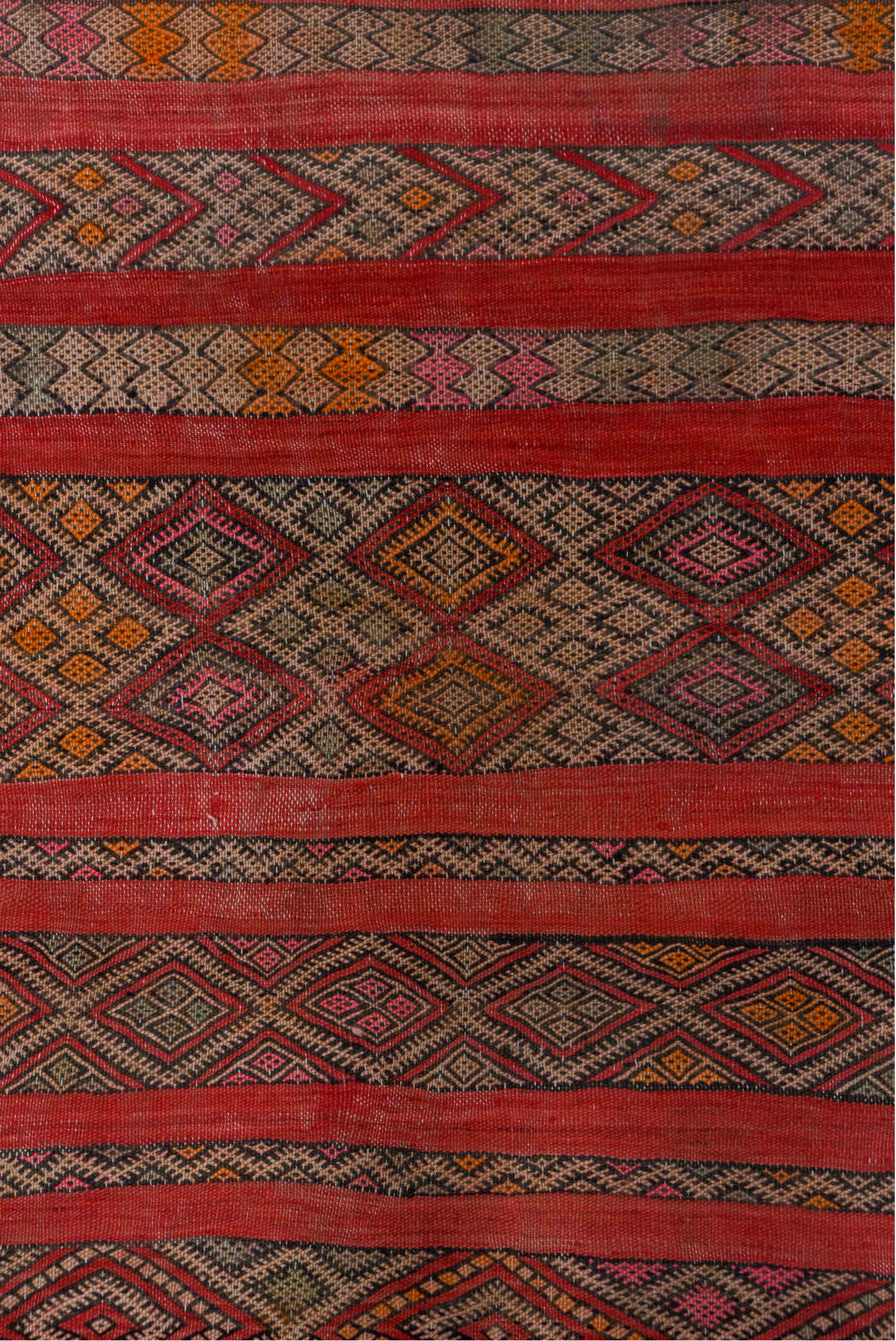 5' x 7' one-of-a-kind handmade vintage Kilim rug. Color palette: rose, rust, charcoal, taupe, ochre, pink, ivory, red