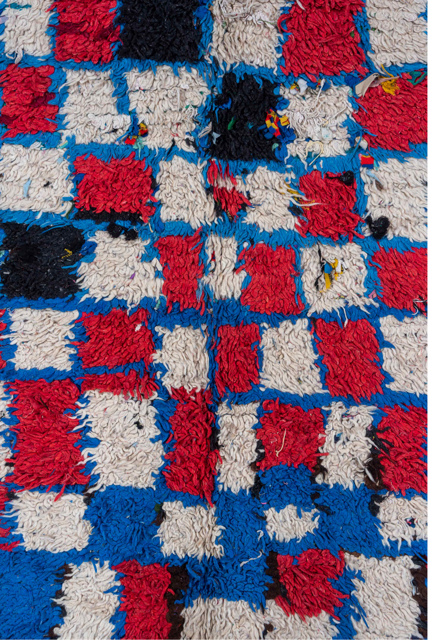 4' x 10' one-of-a-kind handmade vintage Moroccan runner rug. Color palette: black, blue, brown, charcoal, fiord, gray