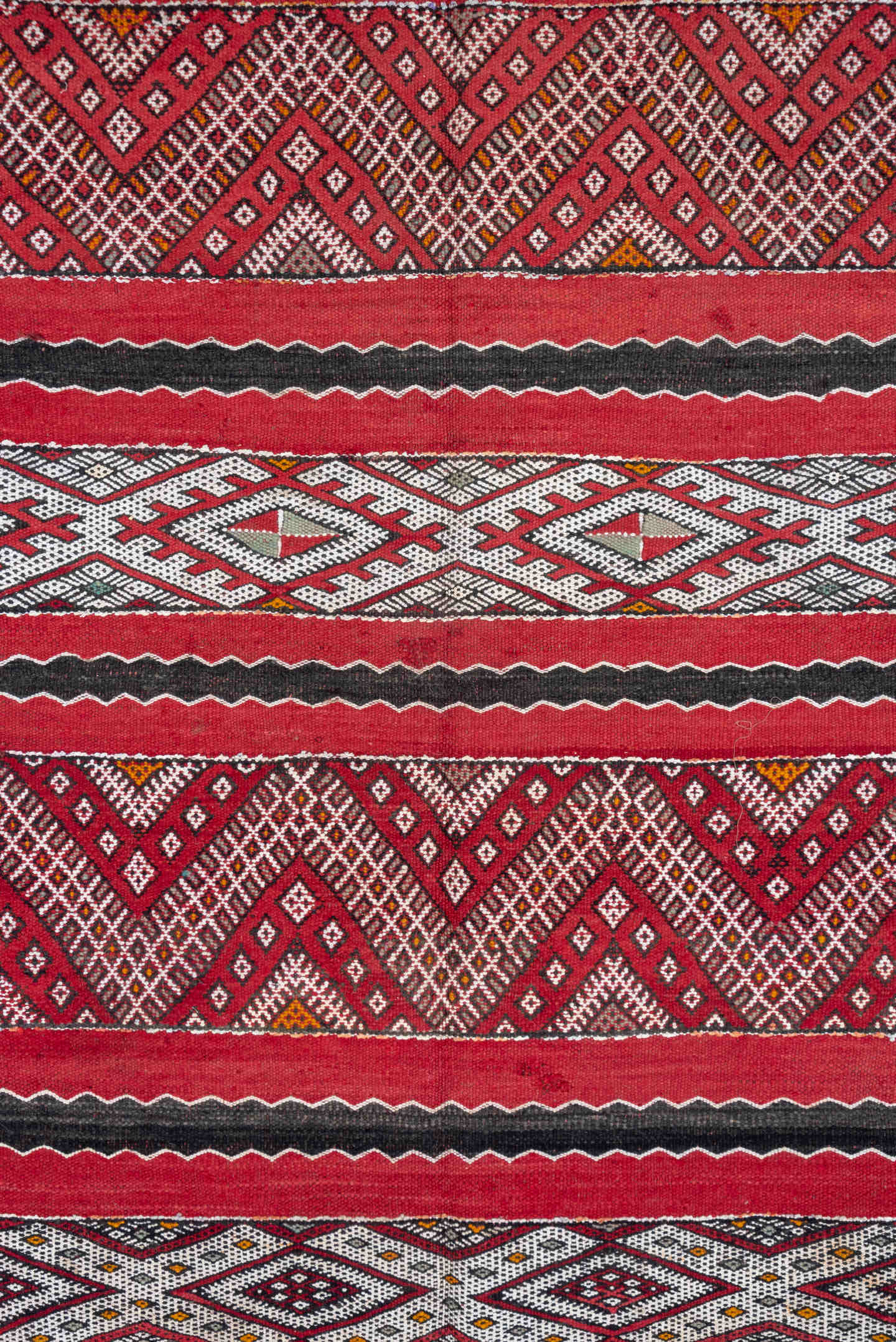 4' x 8' one-of-a-kind handmade vintage Kilim rug. Color palette: red, ivory, charcoal, rust, brown, gray, black, terracotta