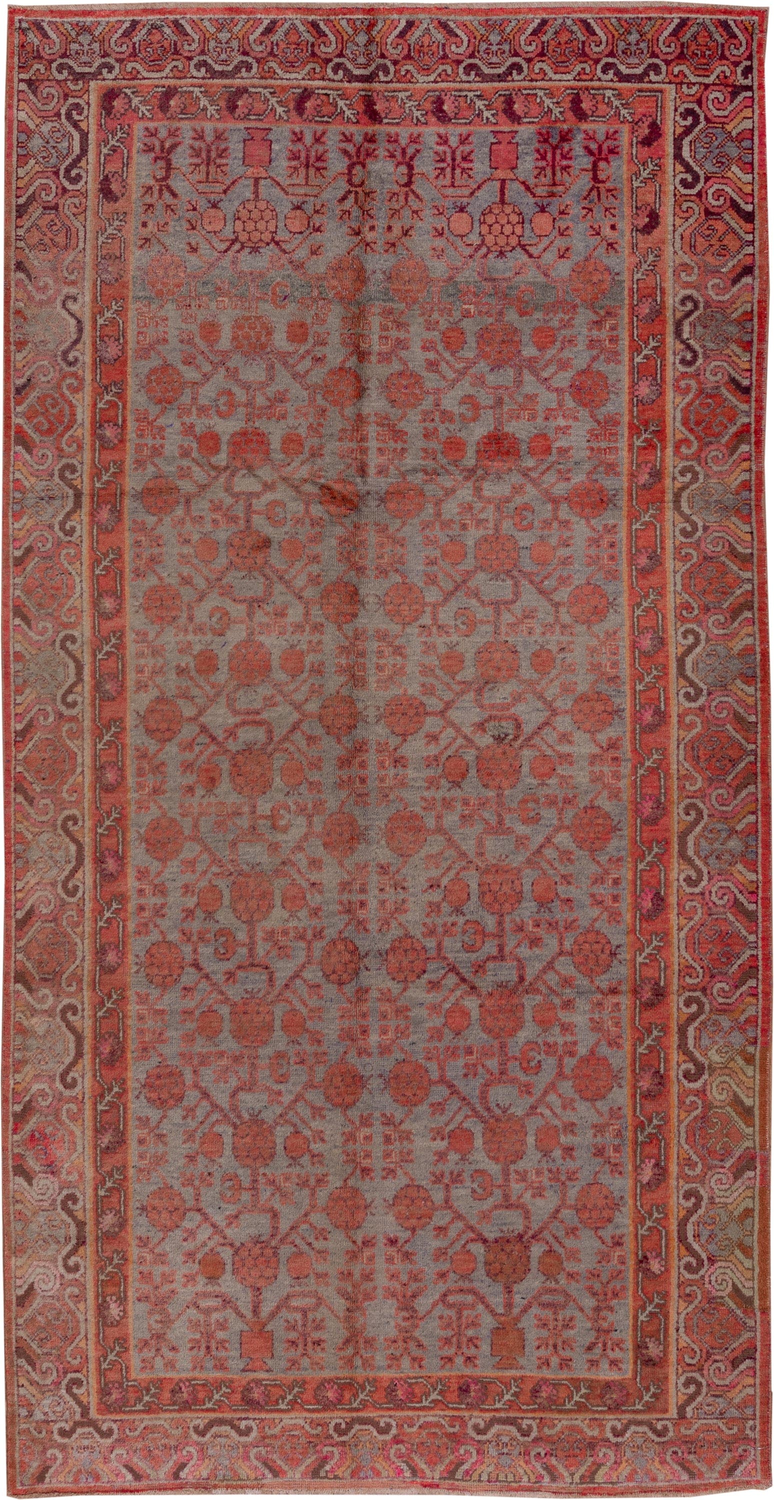 5' x 10' one-of-a-kind handmade vintage Khotan medium size rug. Color palette: rose, rust, taupe, terra cotta, dusty blue