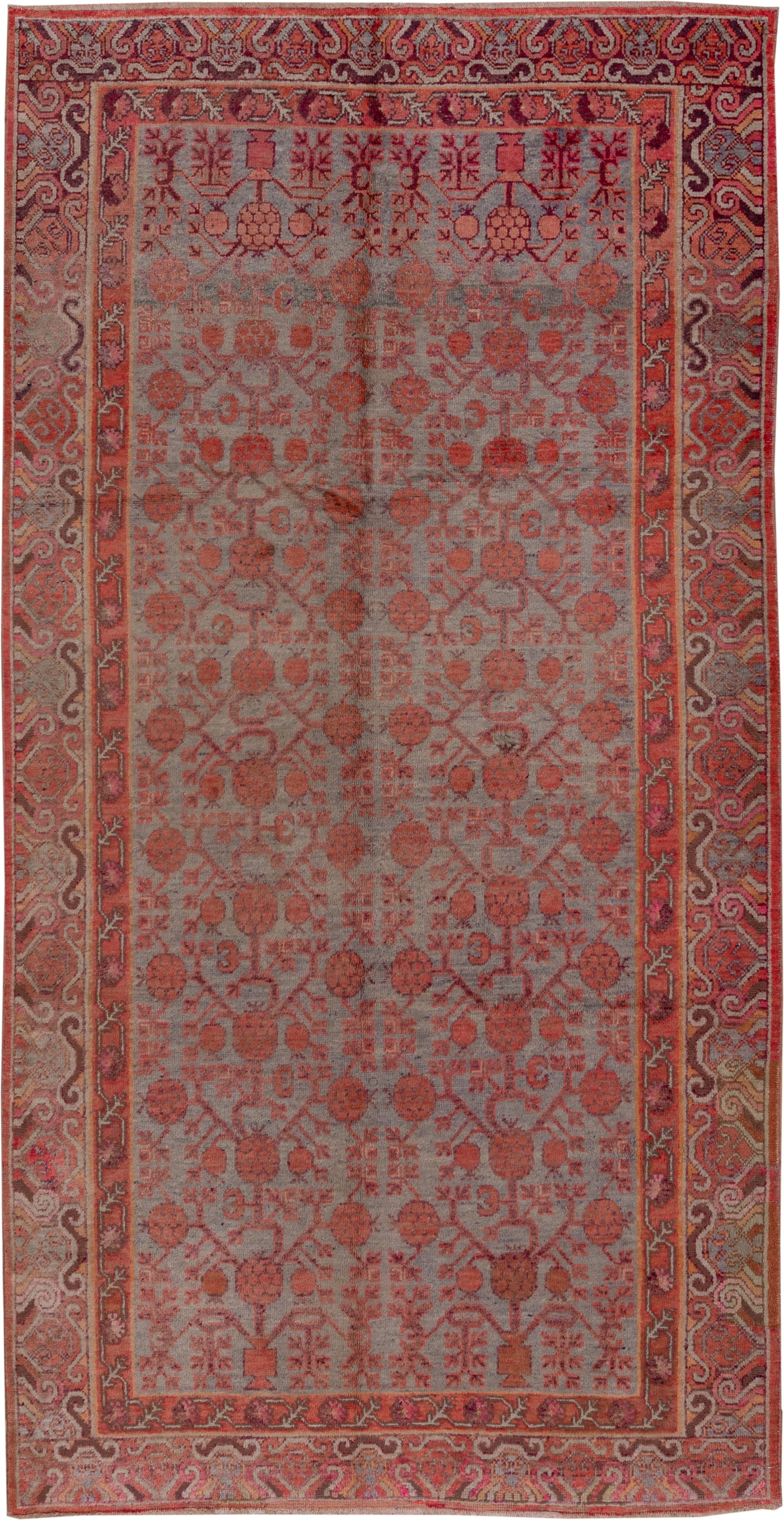 5' x 10' one-of-a-kind handmade vintage Khotan medium size rug. Color palette: rose, rust, taupe, terra cotta, dusty blue