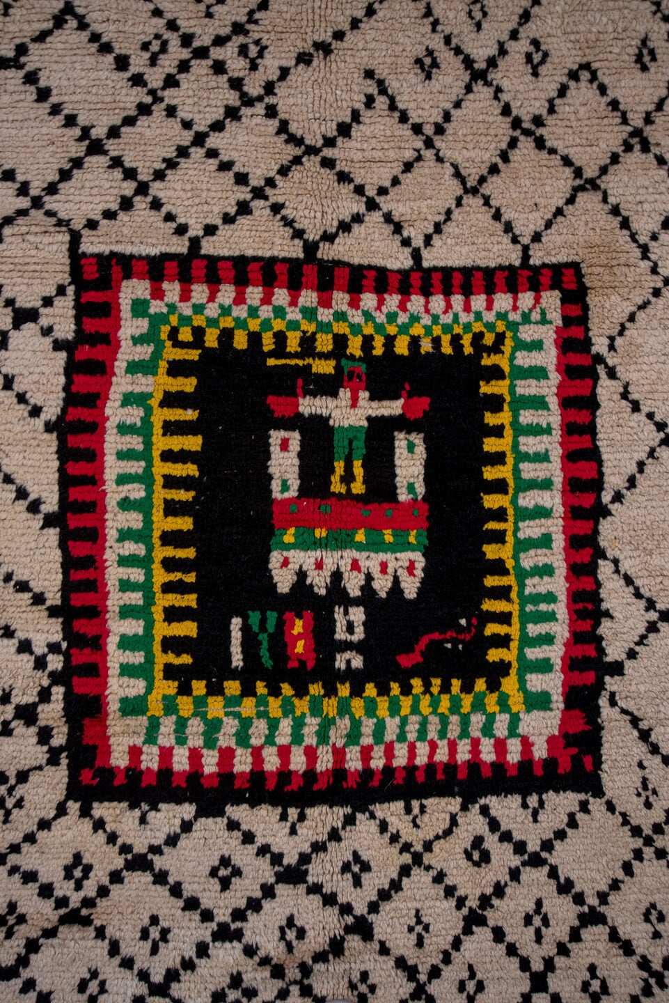 5' x 7' one-of-a-kind handmade antique Moroccan rug. Color palette: ivory, black, crimson, green, gold, rose, red, pink
