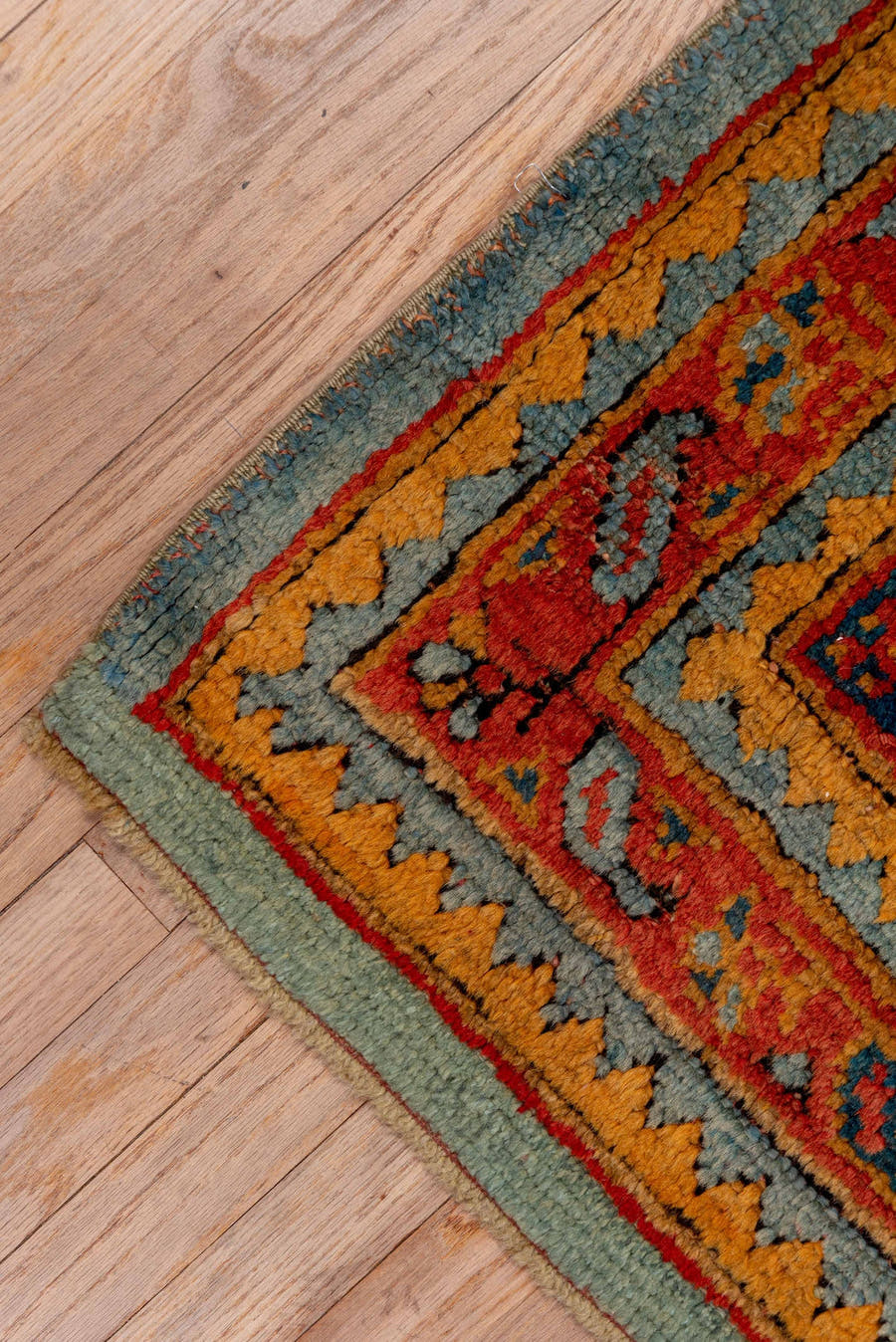7' x 8' one-of-a-kind handmade antique Oushak rug. Color palette: rust, blue, gold, ivory, slate, terra cotta, charcoal