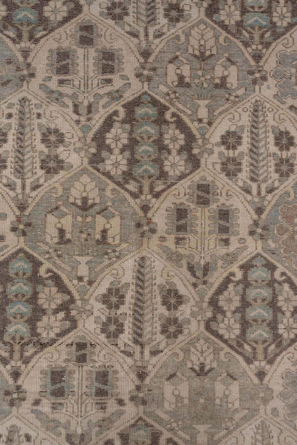 5' x 9' one-of-a-kind handmade antique Baktiary medium size rug. Color palette: taupe, ivory, slate, charcoal, camel