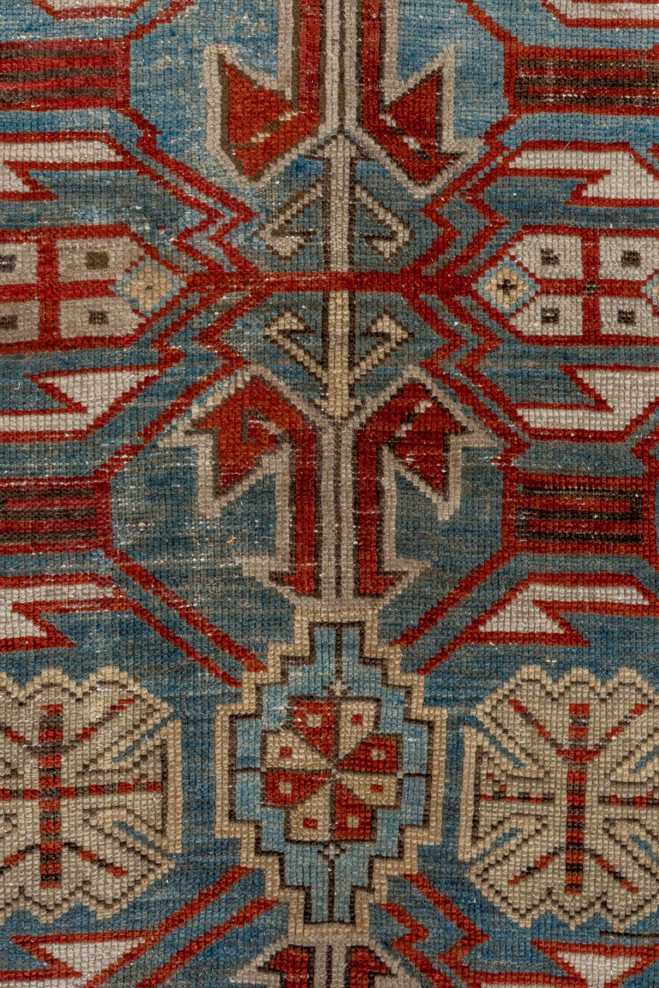 5' x 9' one-of-a-kind handmade antique Caucasian medium size rug. Color palette: light blue, ivory, rust, red, slate, camel