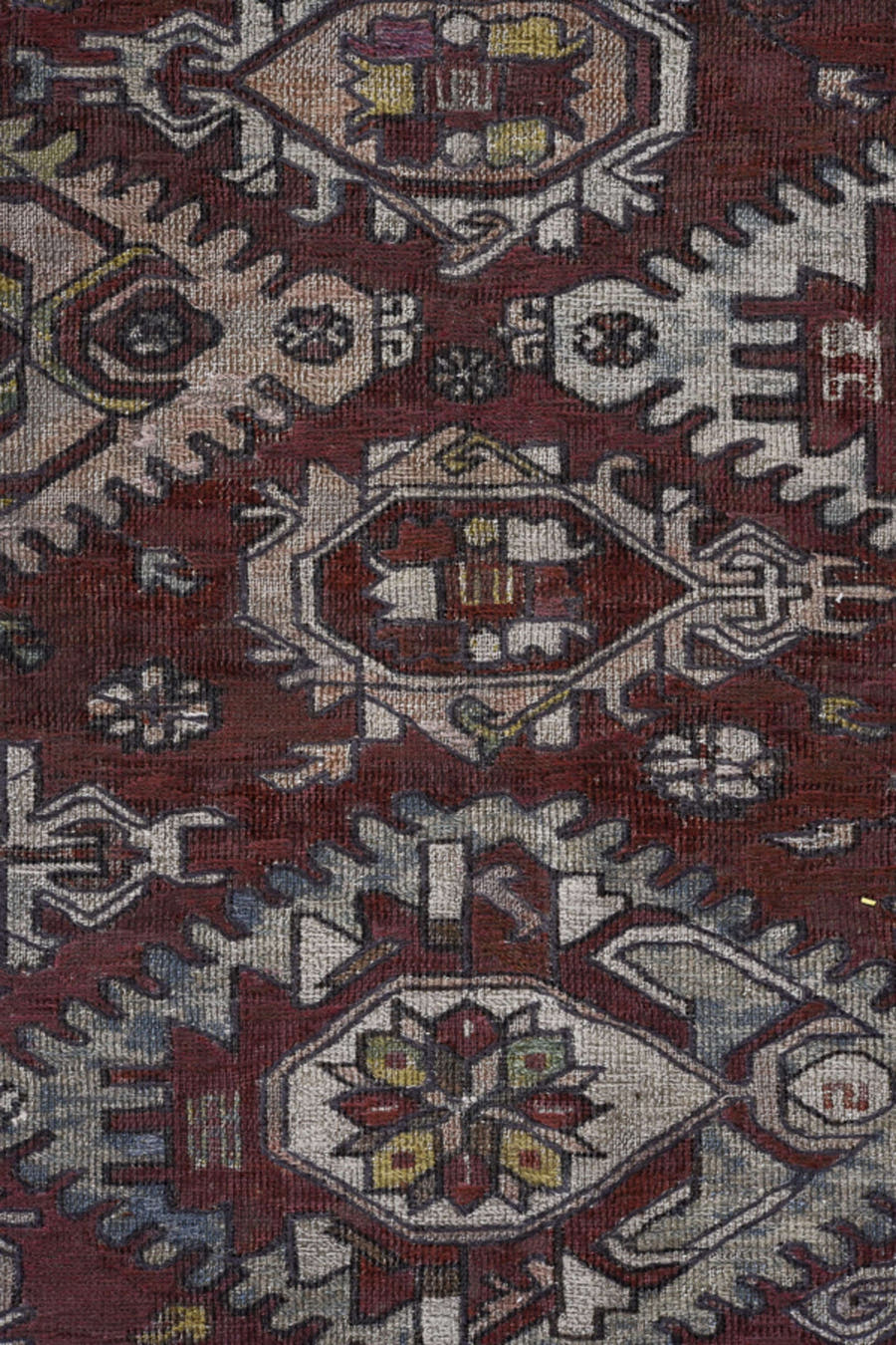 7' x 9' one-of-a-kind handmade antique Sumak rug. Color palette: rust, ivory, slate, sage, gold, charcoal, camel, terracotta