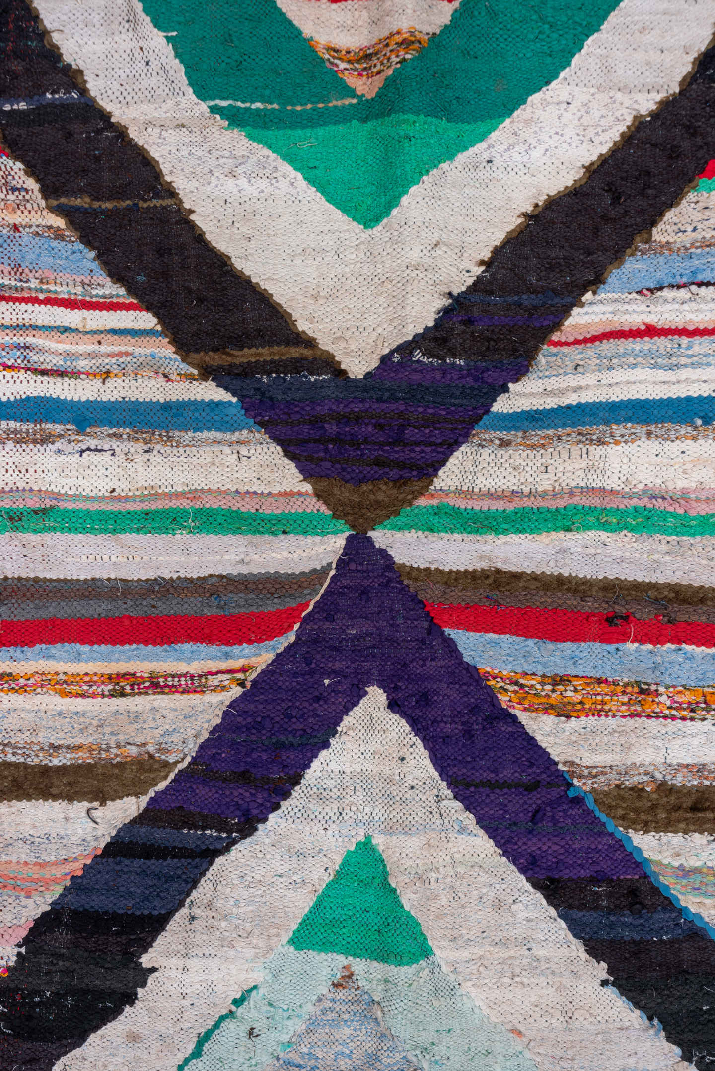 5' x 8' one-of-a-kind handmade vintage Rag Rug medium size rug. Color palette: ivory, black, teal, red, sky_blue, violet