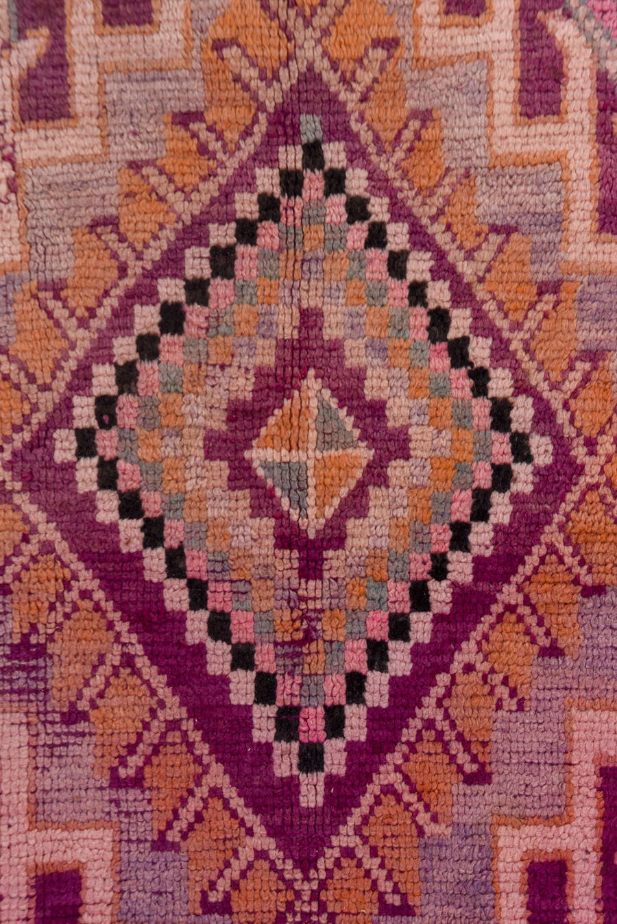 5' x 8' one-of-a-kind handmade vintage Moroccan medium size rug. Color palette: magenta, rose, mauve, peach, plum, lavender