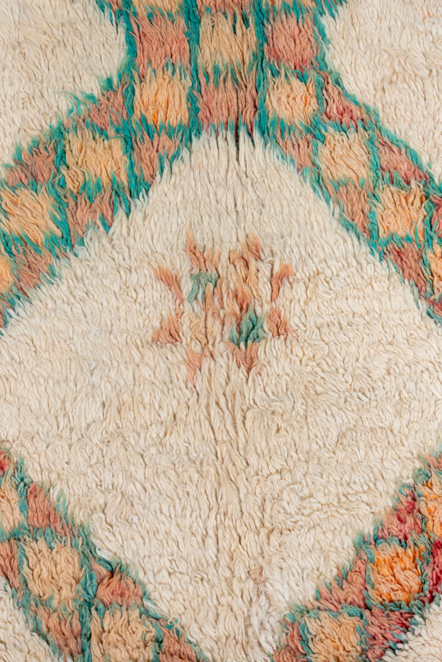 5' x 9' one-of-a-kind handmade vintage Moroccan medium size rug. Color palette: ivory, peach, teal, coral, orange, red