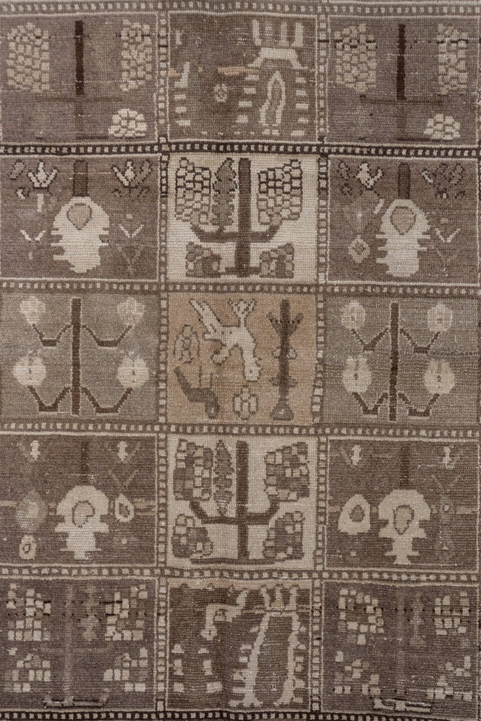 5' x 9' one-of-a-kind handmade antique Baktiary medium size rug. Color palette: taupe, brown, ivory, charcoal, camel, beige