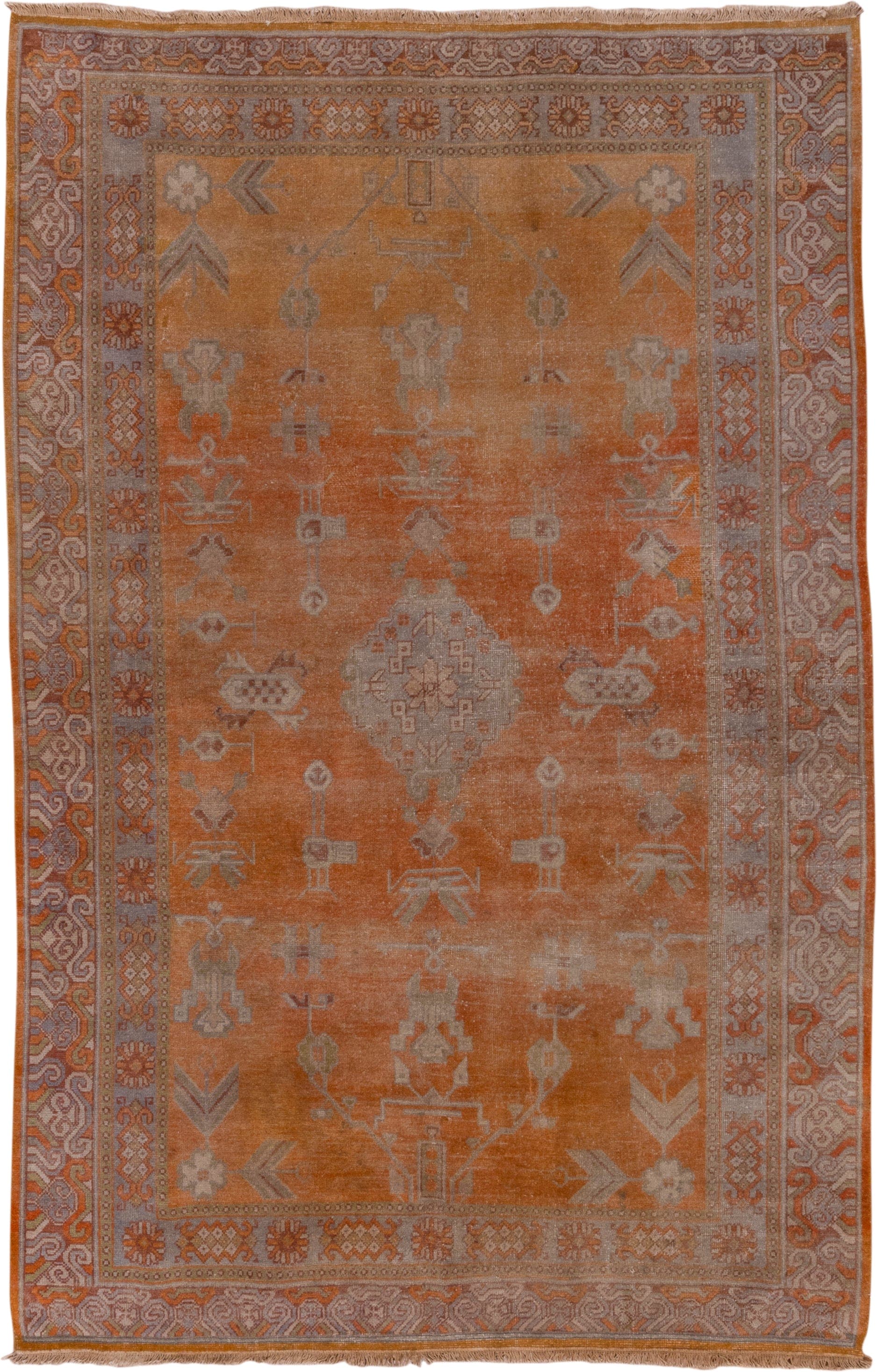 5' x 9' one-of-a-kind handmade antique Khotan medium size rug. Color palette: terra cotta, taupe, rust, camel, ivory, sienna
