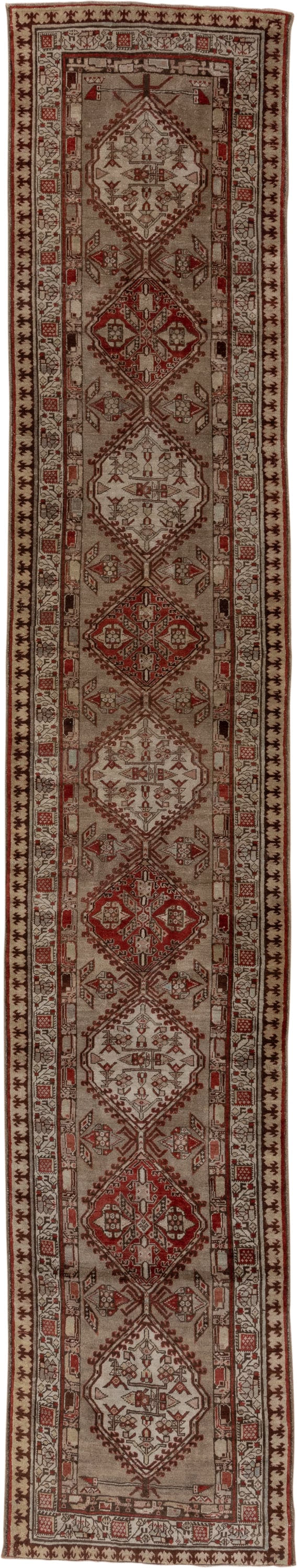 3' x 16' one-of-a-kind handmade antique Sarab runner rug. Color palette: ivory, rust, brown, camel, taupe, brick, charcoal