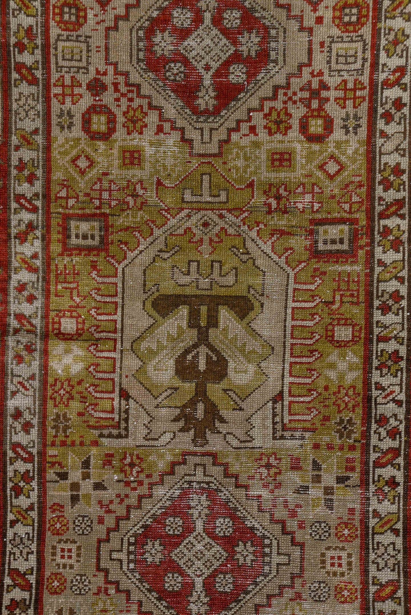 3' x 12' one-of-a-kind handmade antique Karaje runner rug. Color palette: ivory, rust, brick, taupe, camel, brown, rose