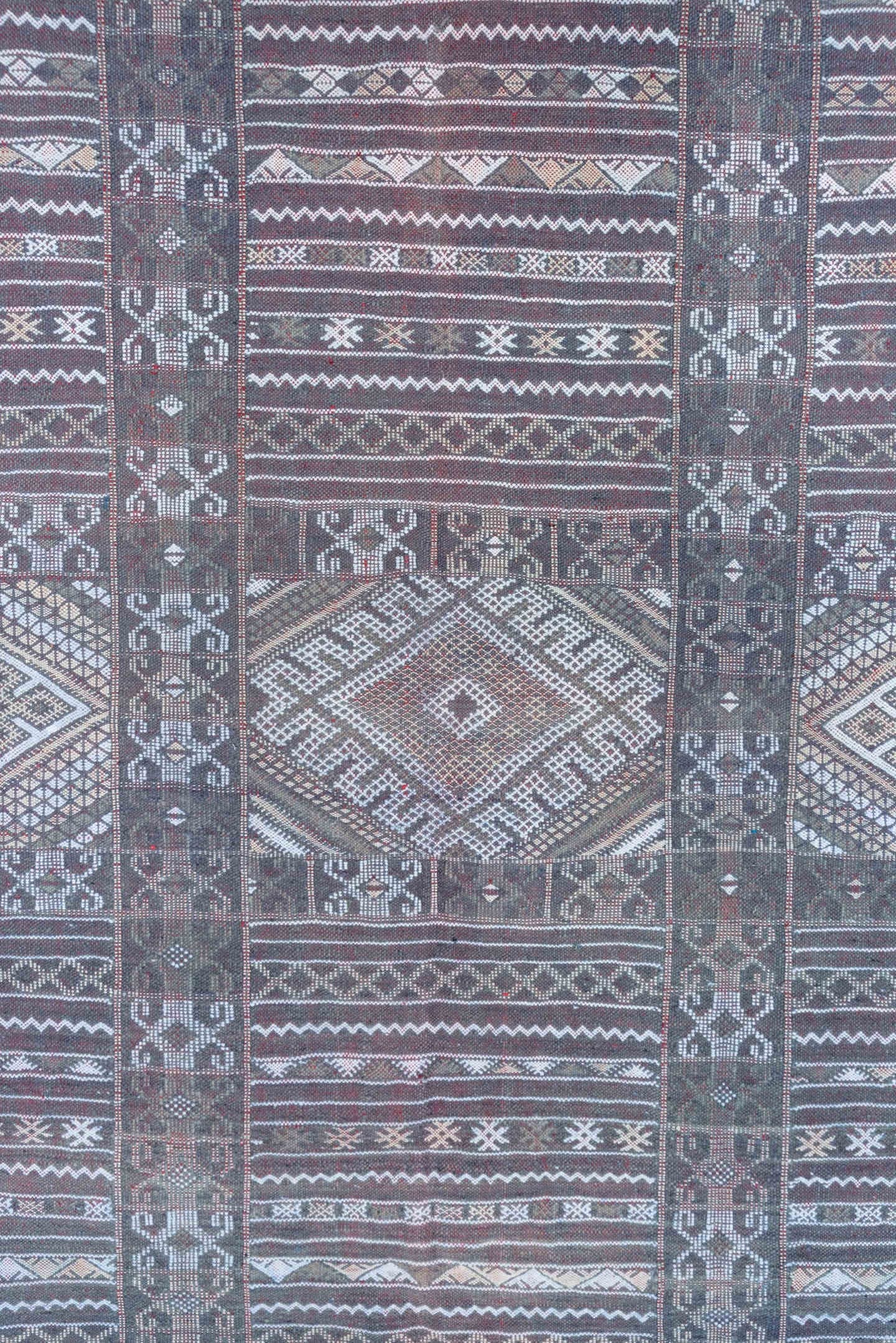 6' x 9' one-of-a-kind handmade vintage Jijim medium size rug. Color palette: taupe, brown, ivory, burgundy, rose, charcoal