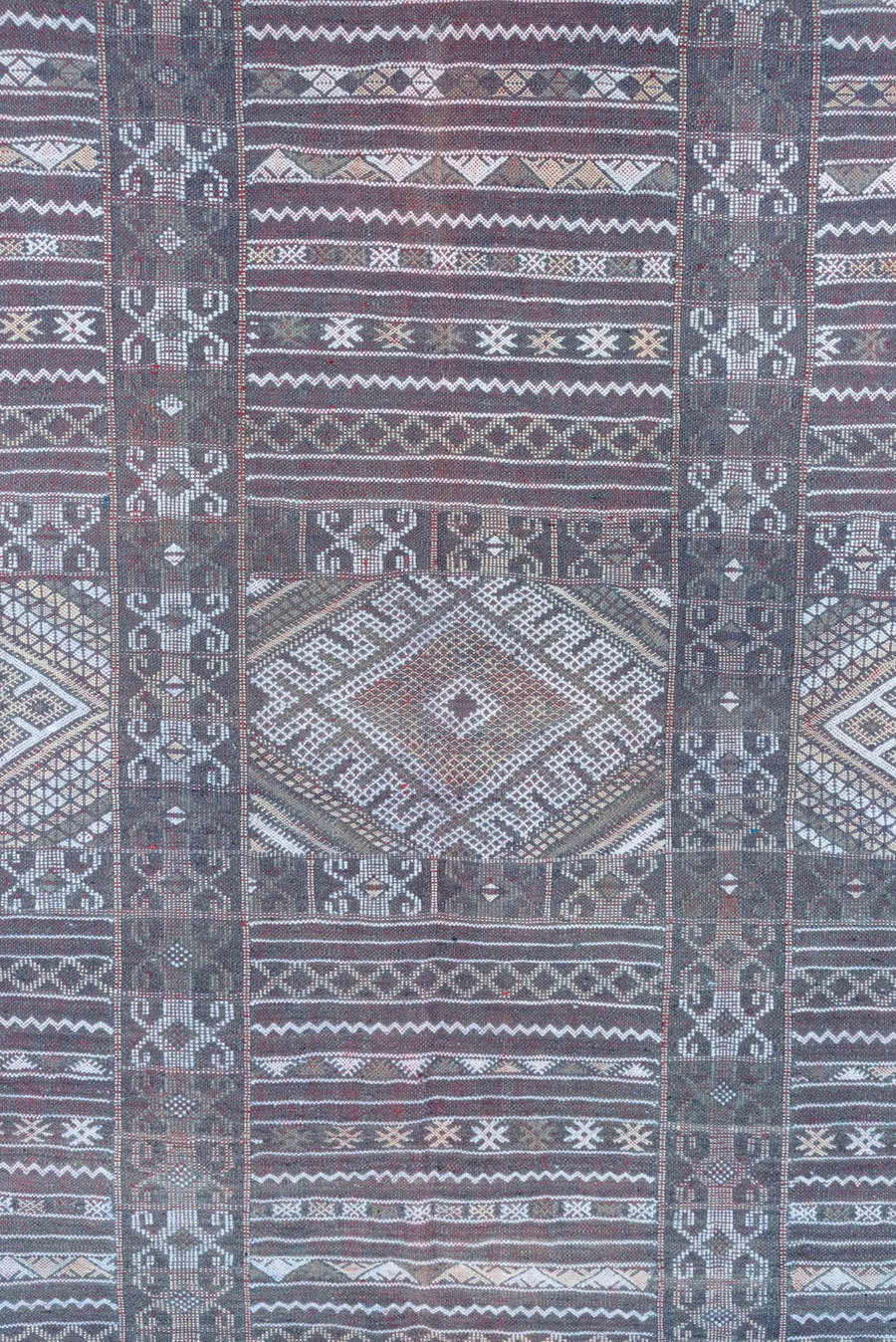 6' x 9' one-of-a-kind handmade vintage Jijim medium size rug. Color palette: taupe, brown, ivory, burgundy, rose, charcoal