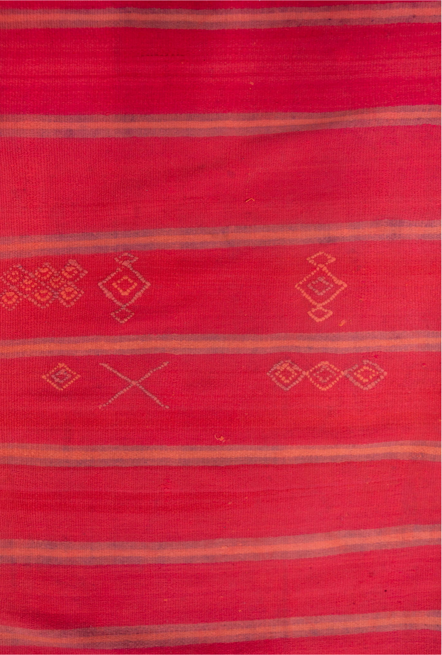 5' x 12' one-of-a-kind handmade vintage Blanket rug. Color palette: rose, crimson, terra cotta, taupe, plum, pink, red