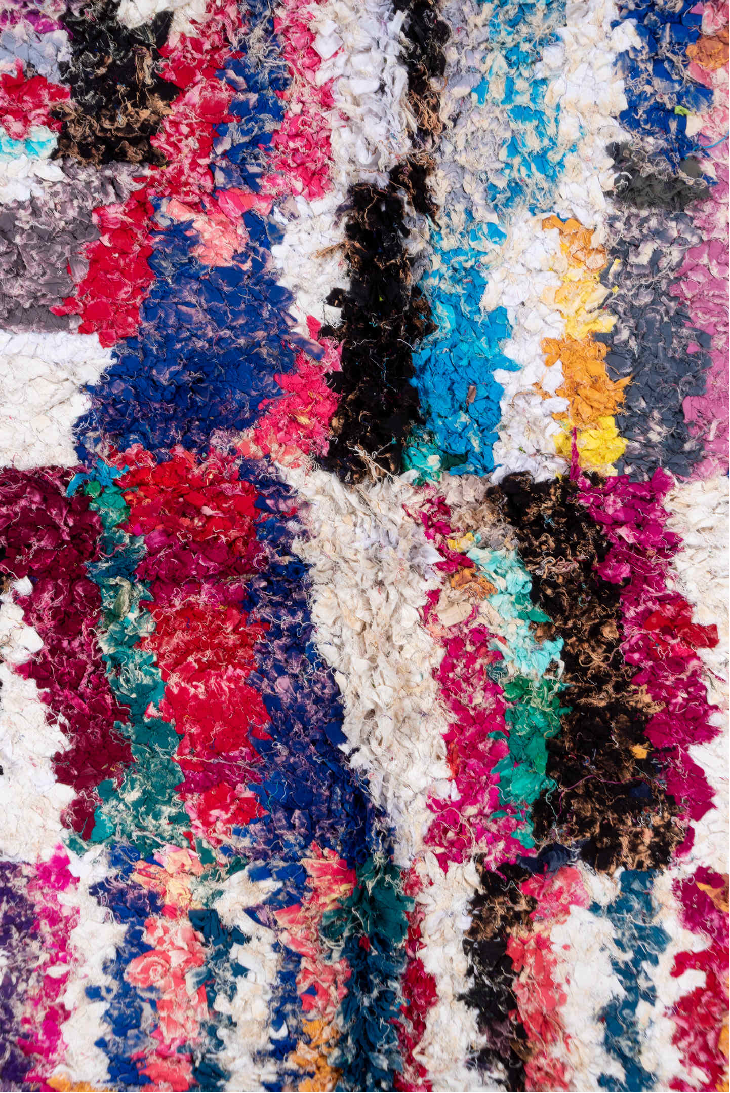 4' x 8' one-of-a-kind handmade vintage Rag Rug rug. Color palette: ivory, magenta, turquoise, cobalt, black, rose, lavender