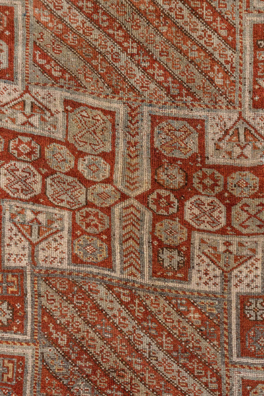 4' x 7' one-of-a-kind handmade antique Kurd rug. Color palette: rust, ivory, terra cotta, brown, taupe, charcoal, terracotta