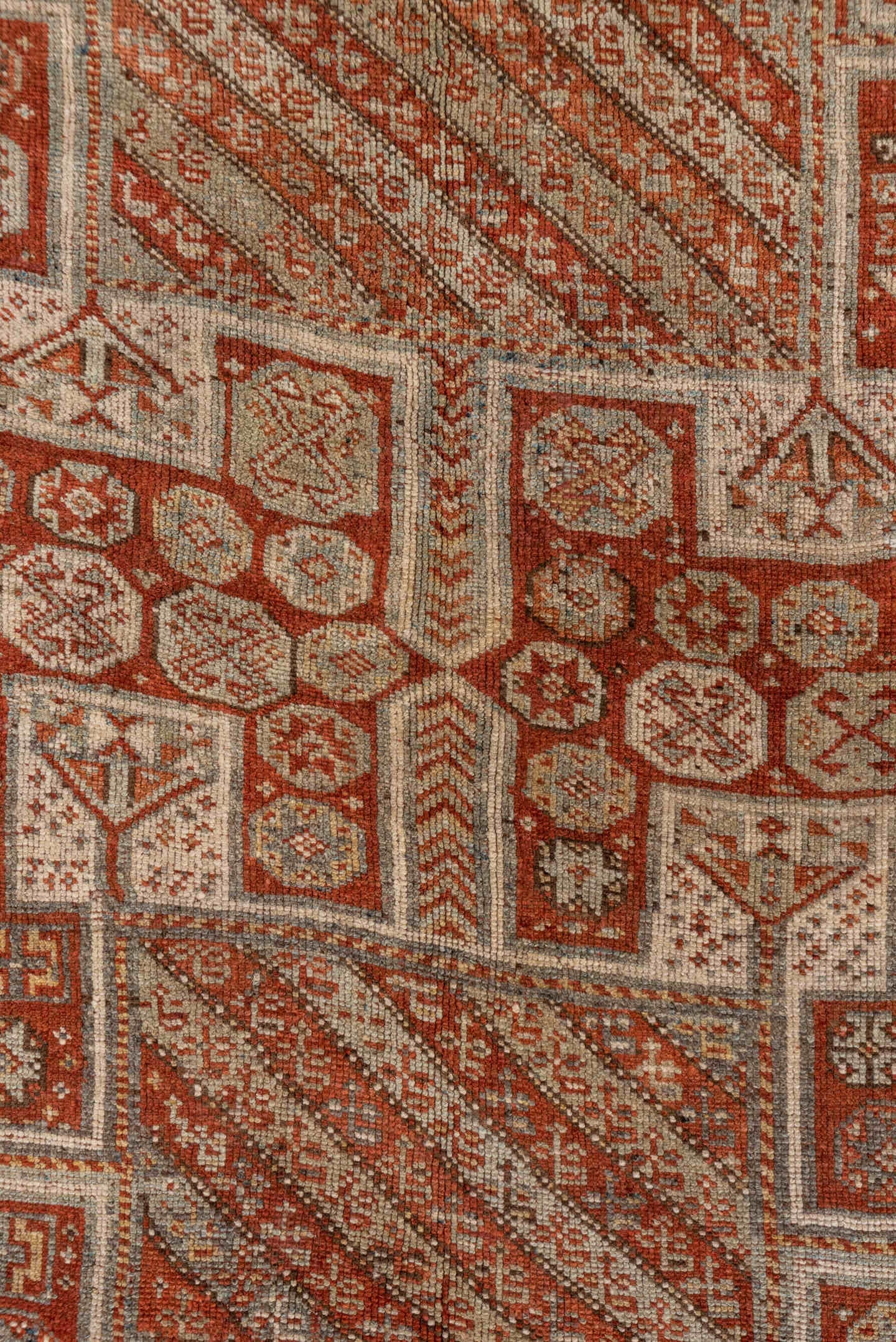 4' x 7' one-of-a-kind handmade antique Kurd rug. Color palette: rust, ivory, terra cotta, brown, taupe, charcoal, terracotta