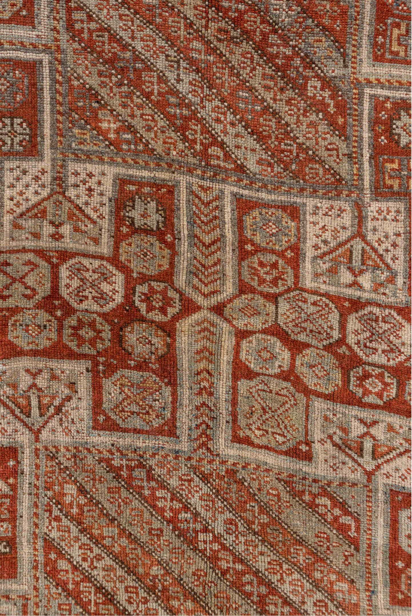 4' x 7' one-of-a-kind handmade antique Kurd rug. Color palette: rust, ivory, terra cotta, brown, taupe, charcoal, terracotta