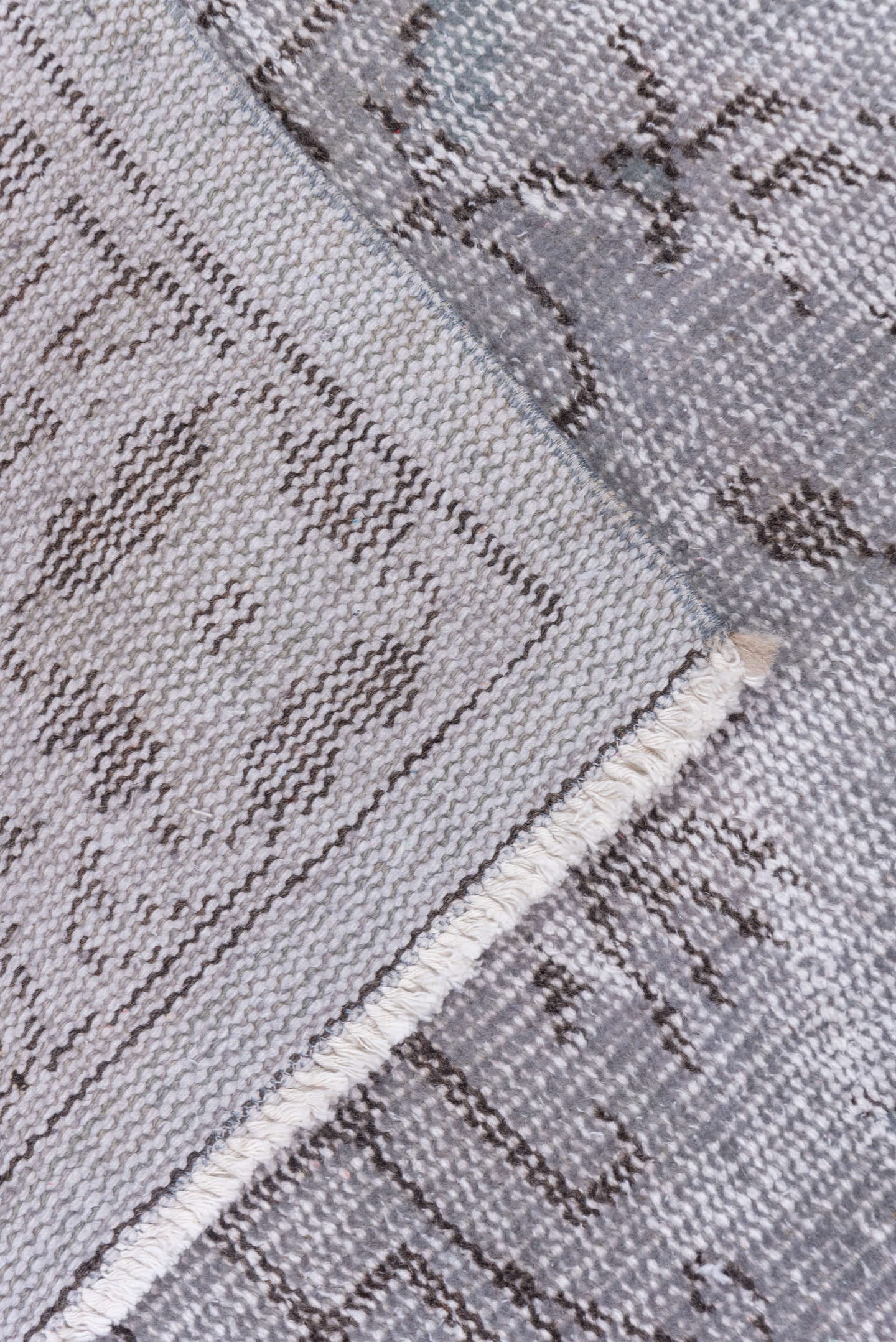 5' x 9' one-of-a-kind handmade vintage Overdyed medium size rug. Color palette: gray, taupe, charcoal, ivory, beige, black