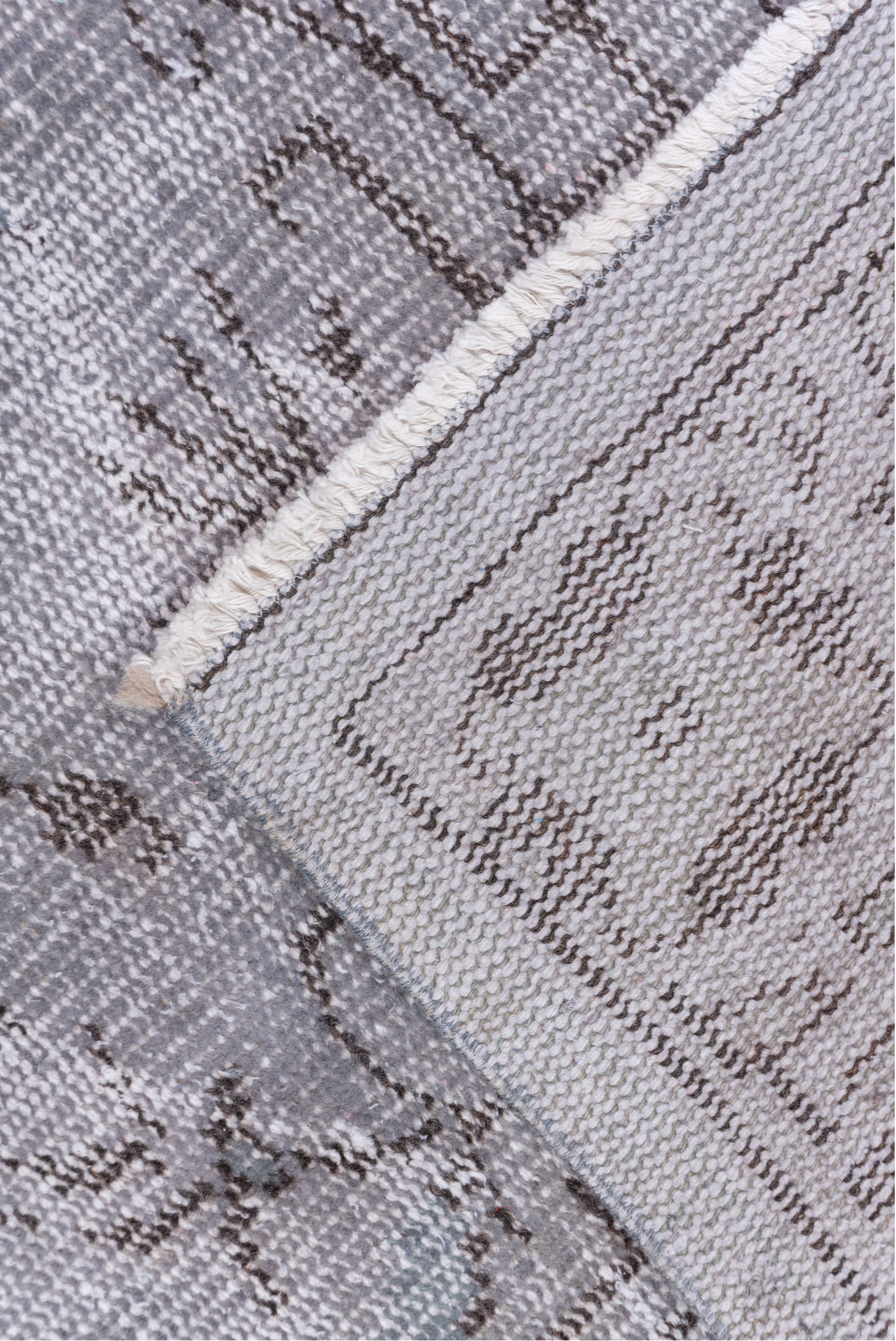 5' x 9' one-of-a-kind handmade vintage Overdyed medium size rug. Color palette: gray, taupe, charcoal, ivory, beige, black