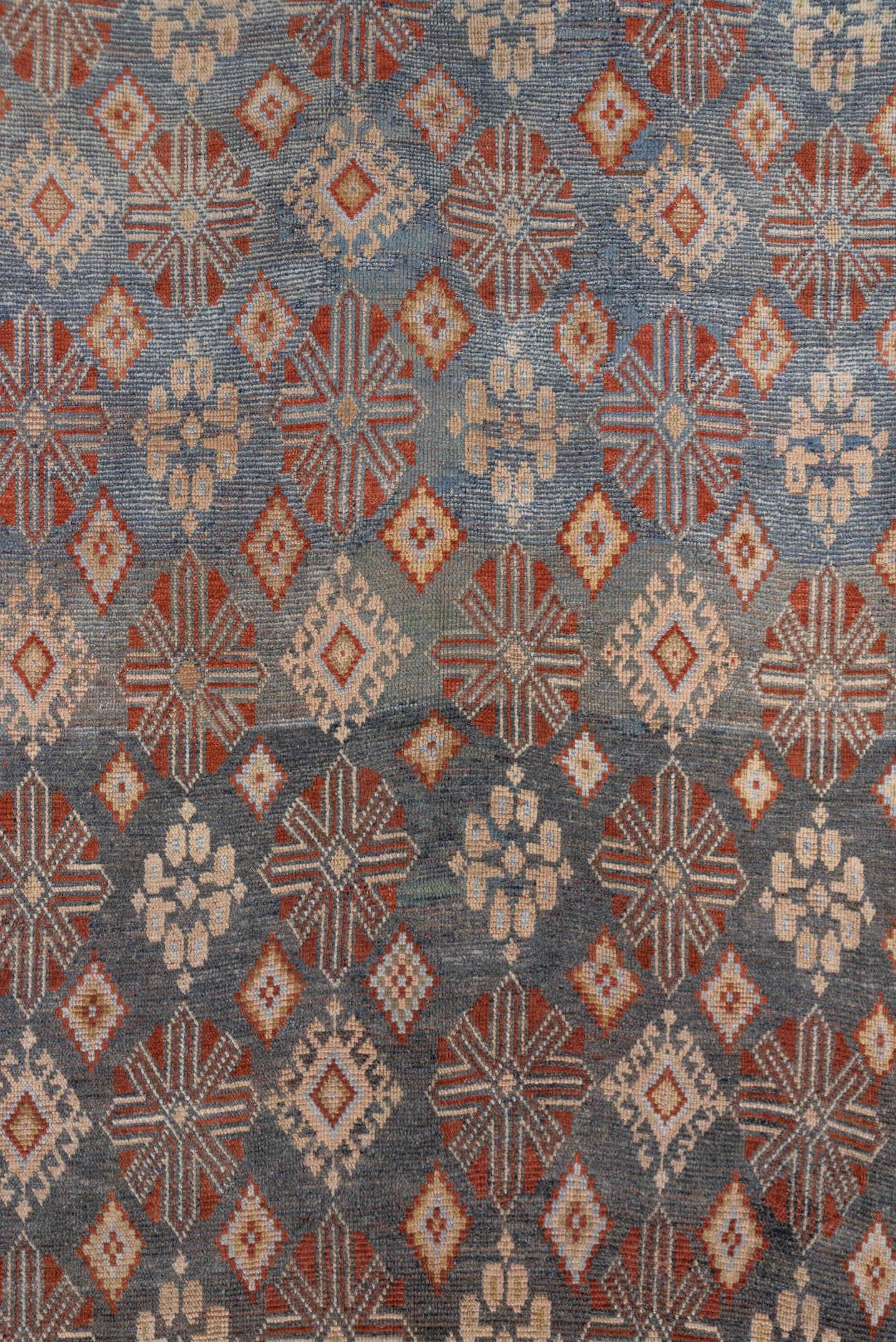 4' x 9' one-of-a-kind handmade antique Caucasian runner rug. Color palette: blue, ivory, rust, taupe, slate, camel