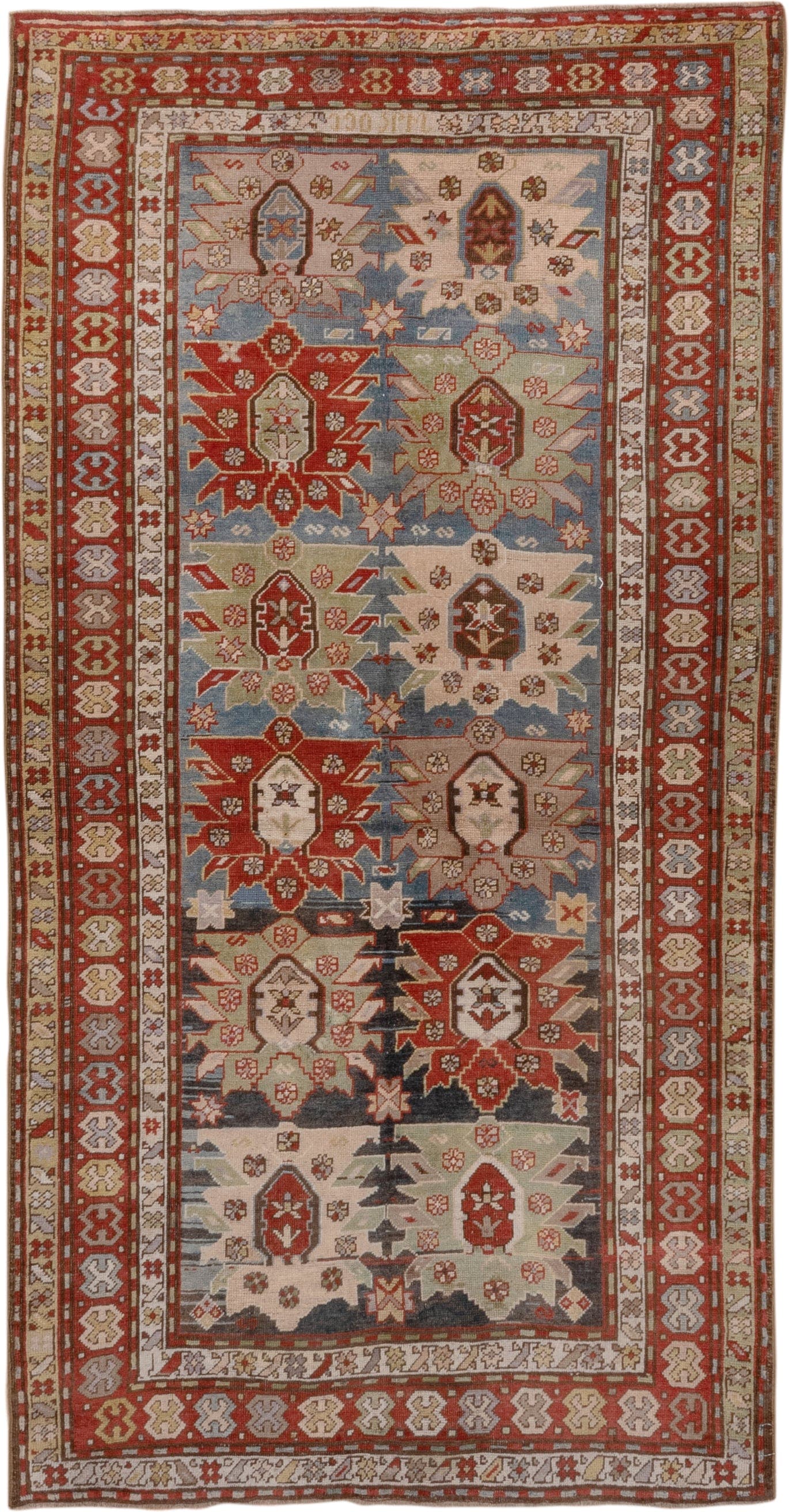4' x 8' one-of-a-kind handmade antique Caucasian rug. Color palette: ivory, rust, brick, slate, sky_blue, camel, charcoal