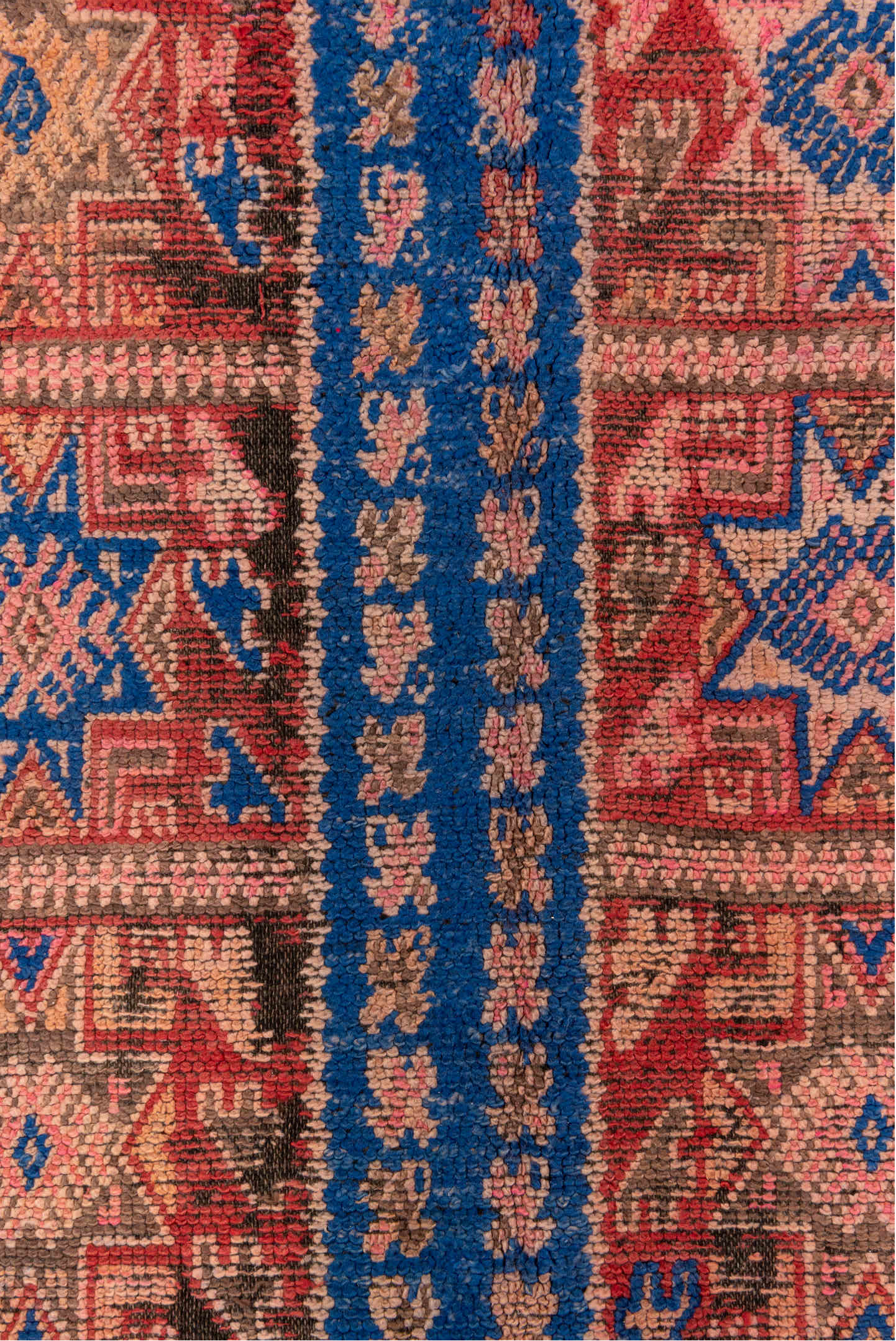 5' x 10' one-of-a-kind handmade vintage Moroccan medium size rug. Color palette: blue, brown, gray, pink, red, redwood