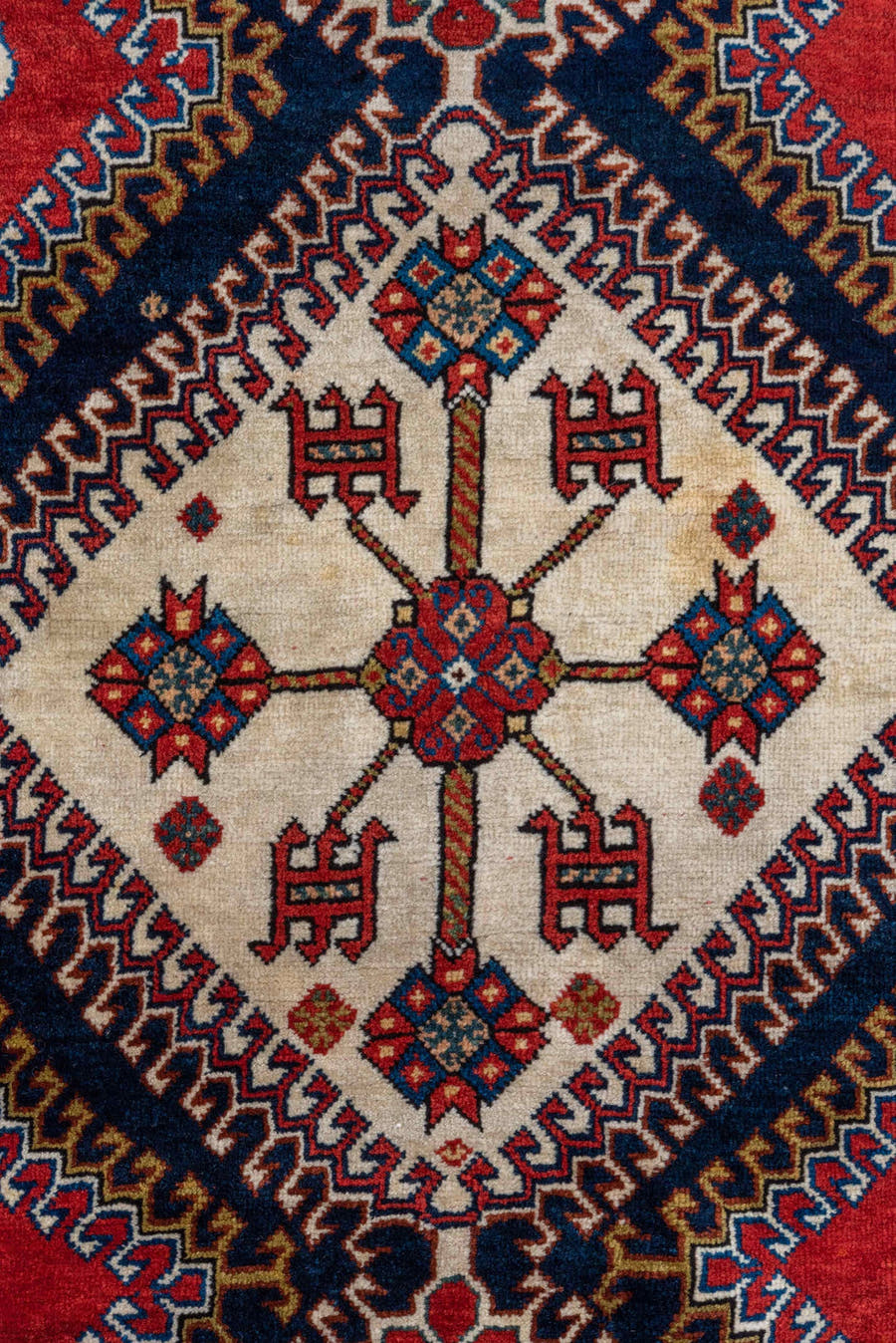 4' x 7' one-of-a-kind handmade vintage Qashqai rug. Color palette: crimson, ivory, indigo, camel, sky_blue, rust, black, red