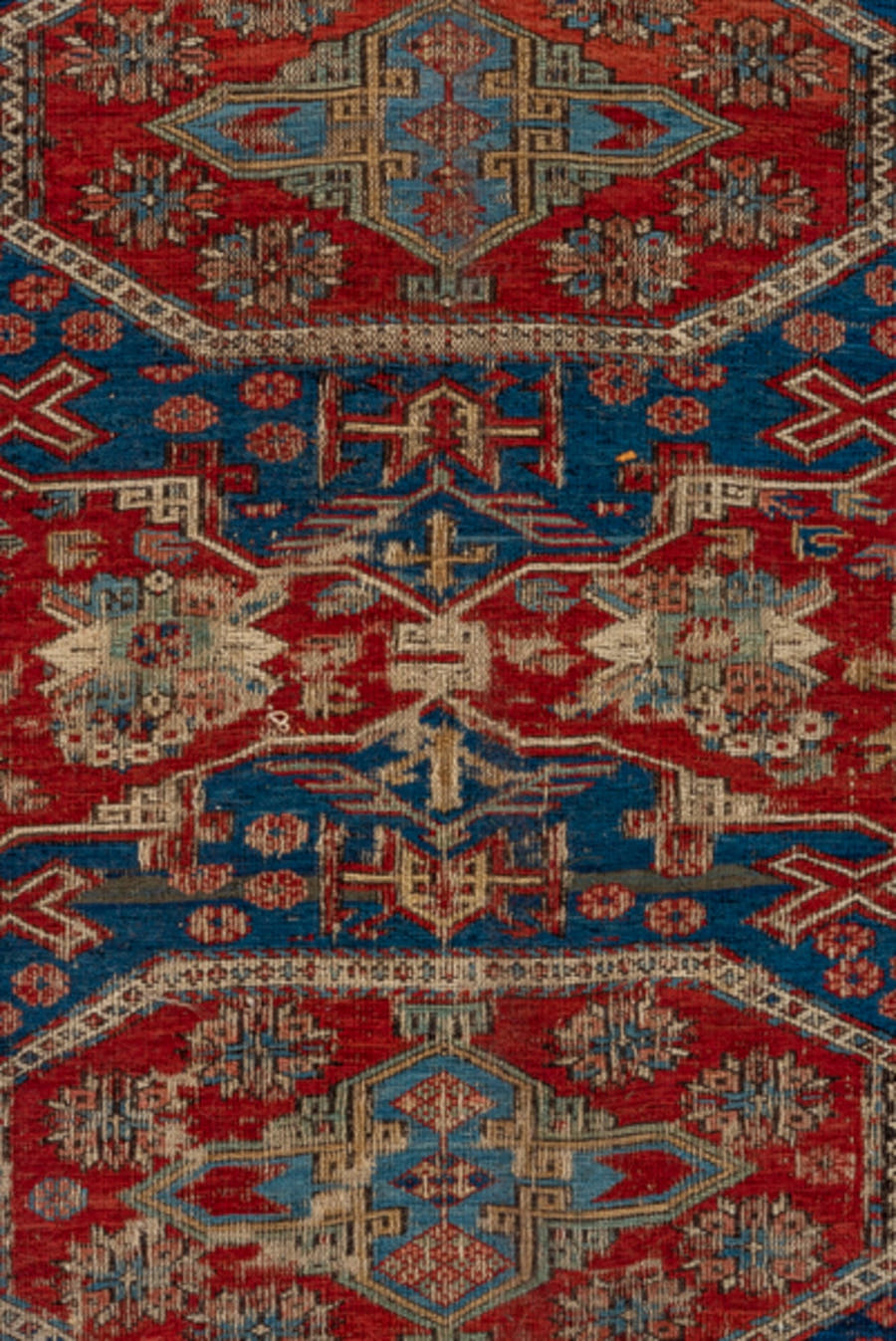 8' x 9' one-of-a-kind handmade antique Sumak rug. Color palette: rust, navy, ivory, sky blue, camel, crimson, terracotta