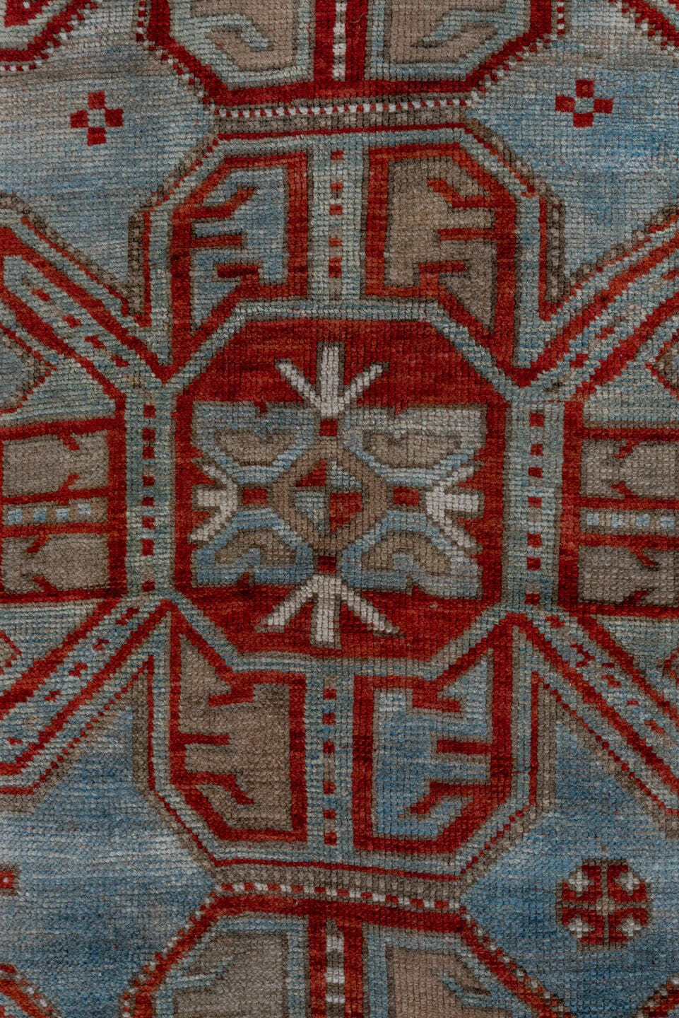 4' x 7' one-of-a-kind handmade antique Kazak rug. Color palette: rust, ivory, sky blue, taupe, brick, camel, terracotta