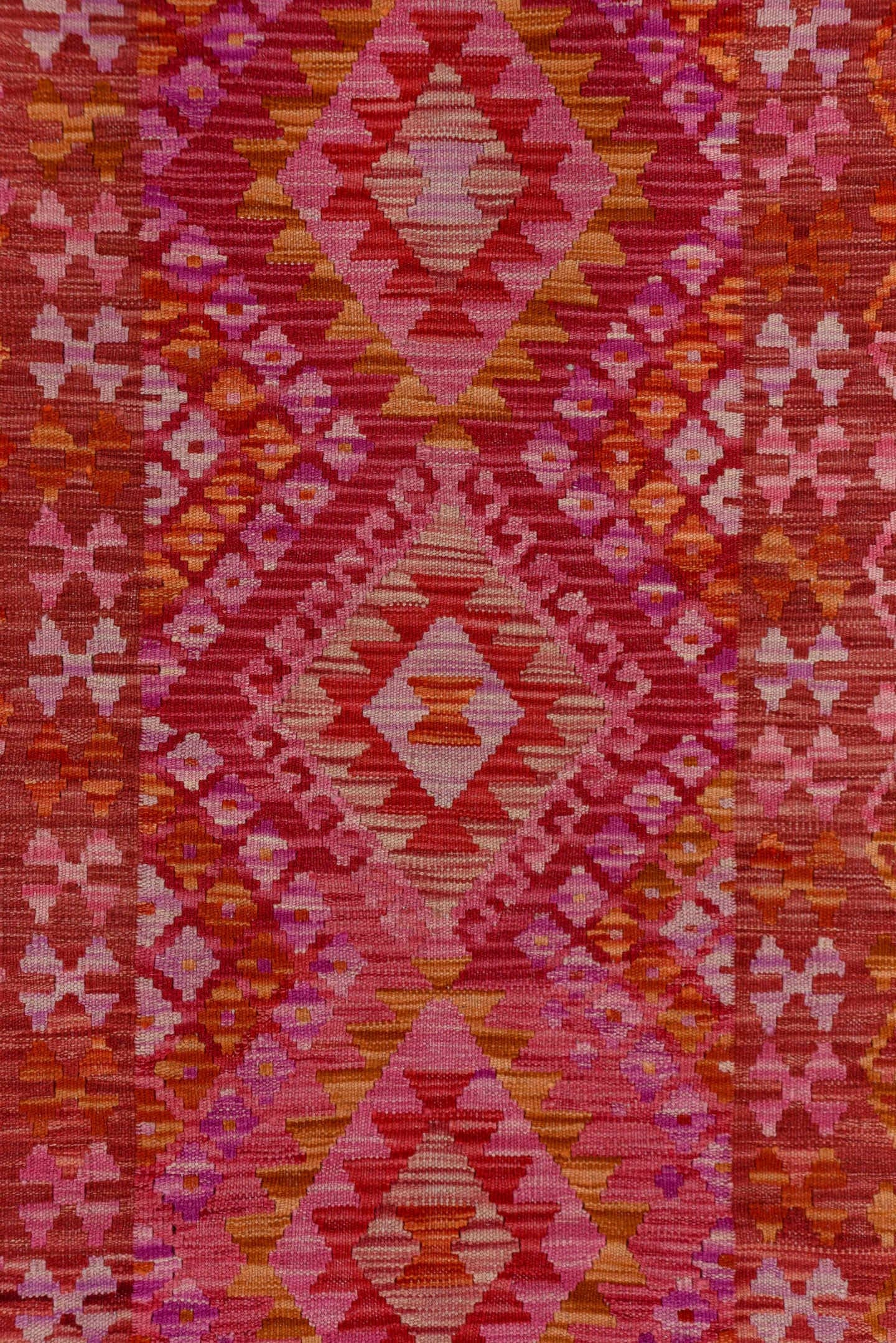 2' x 9' one-of-a-kind handmade vintage Kilim runner rug. Color palette: rose, pink, rust, magenta, terra cotta, ivory