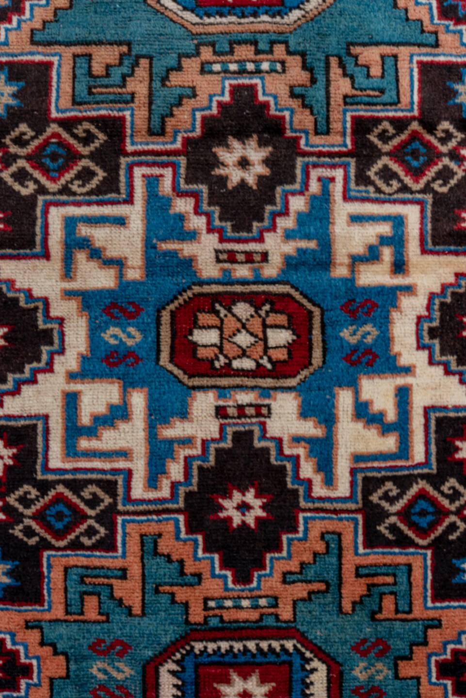 3' x 5' one-of-a-kind handmade antique Caucasian small size rug. Color palette: ivory, brown, sky blue, crimson, navy, rose