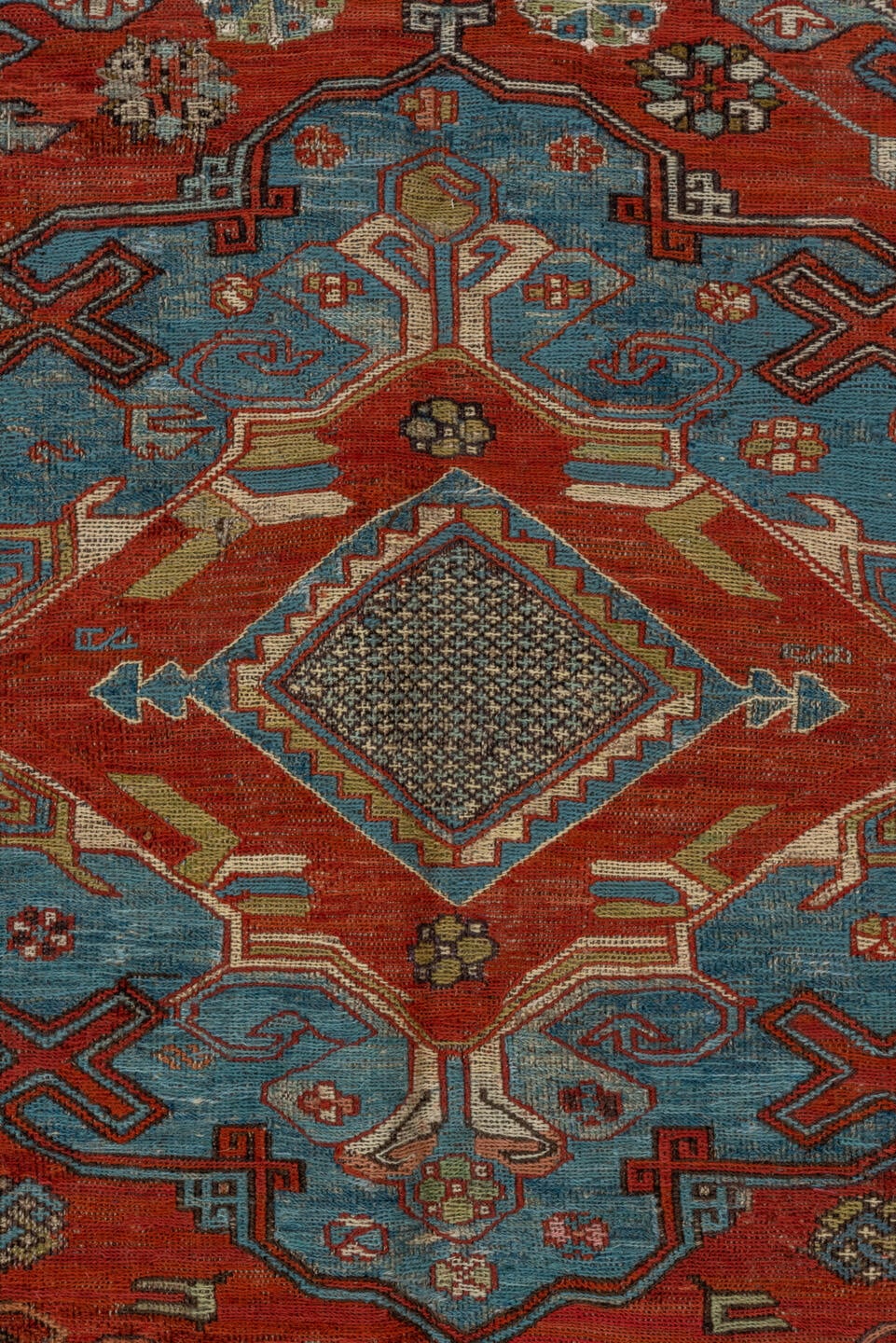 6' x 8' one-of-a-kind handmade antique Sumak medium size rug. Color palette: rust, sky blue, ivory, charcoal, camel