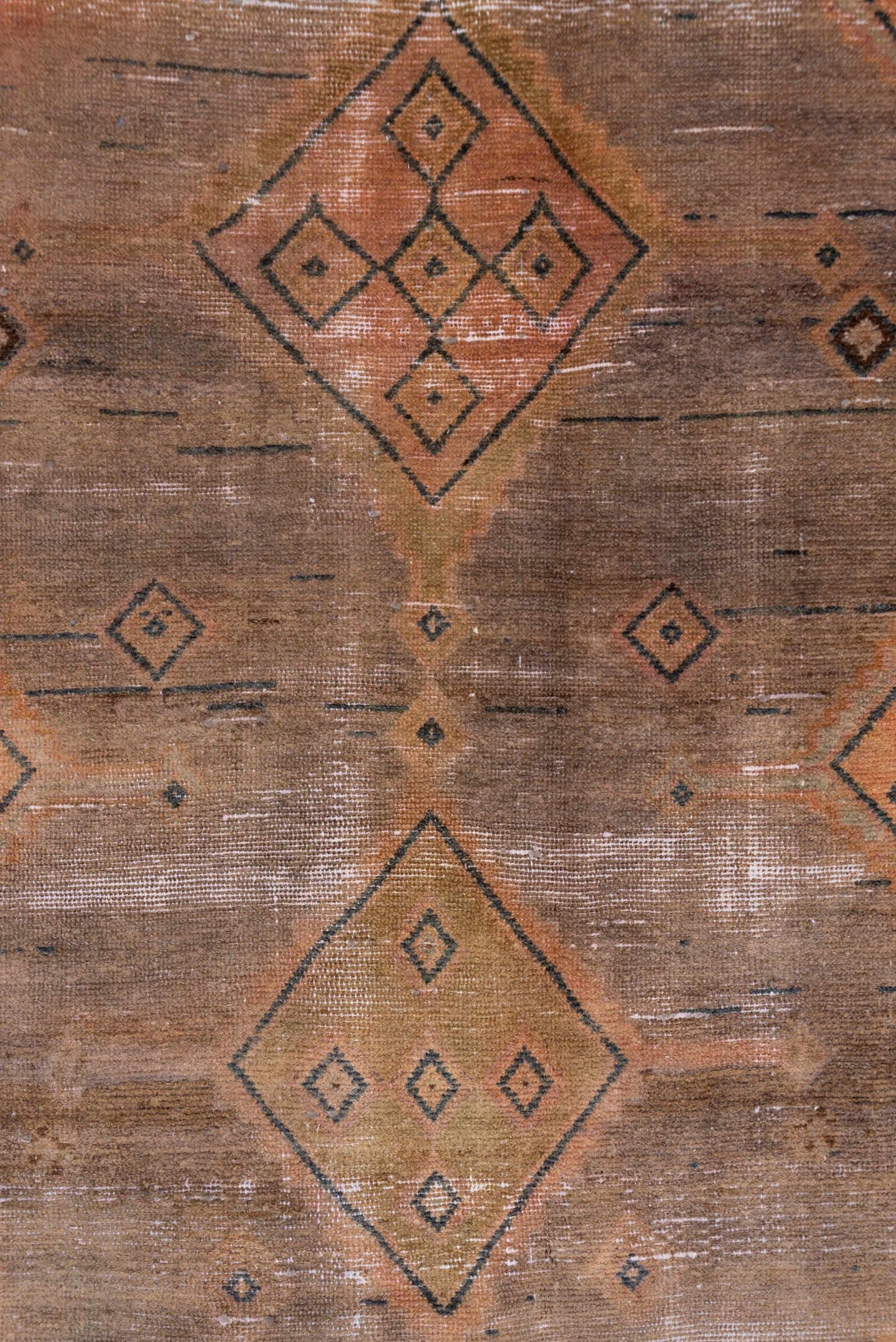 4' x 9' one-of-a-kind handmade vintage Distressed runner rug. Color palette: taupe, terra cotta, brown, charcoal, camel